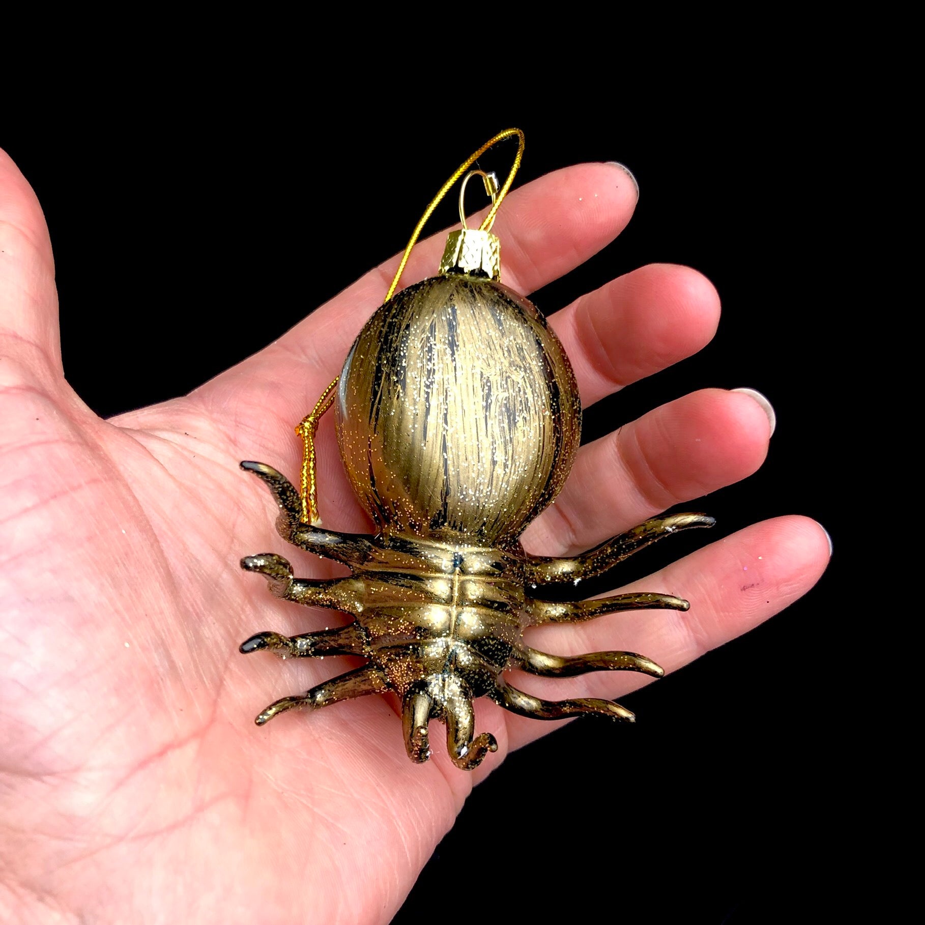 Underside of Spider Ornament shown in hand