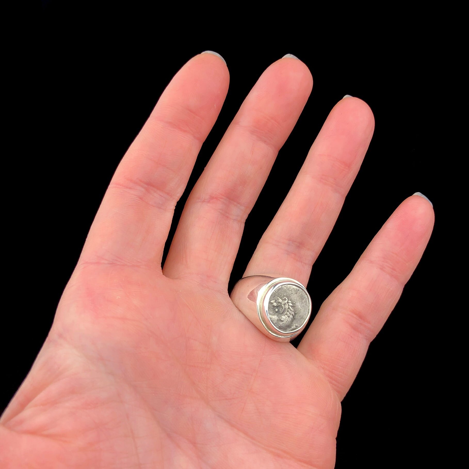 Lion Coin Ring shown on hand.