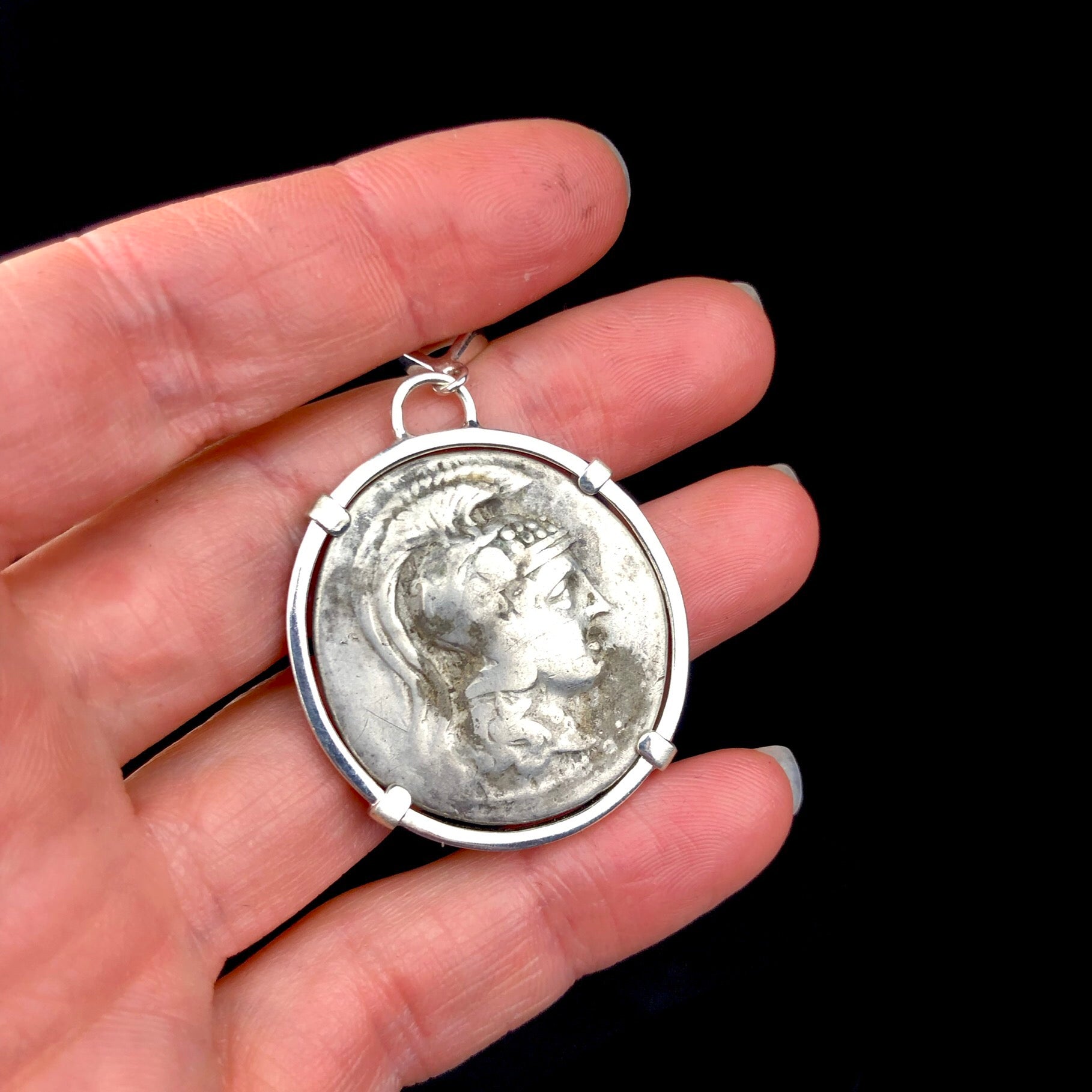 New Style Athena Tetradrachm Coin Pendent shown in hand