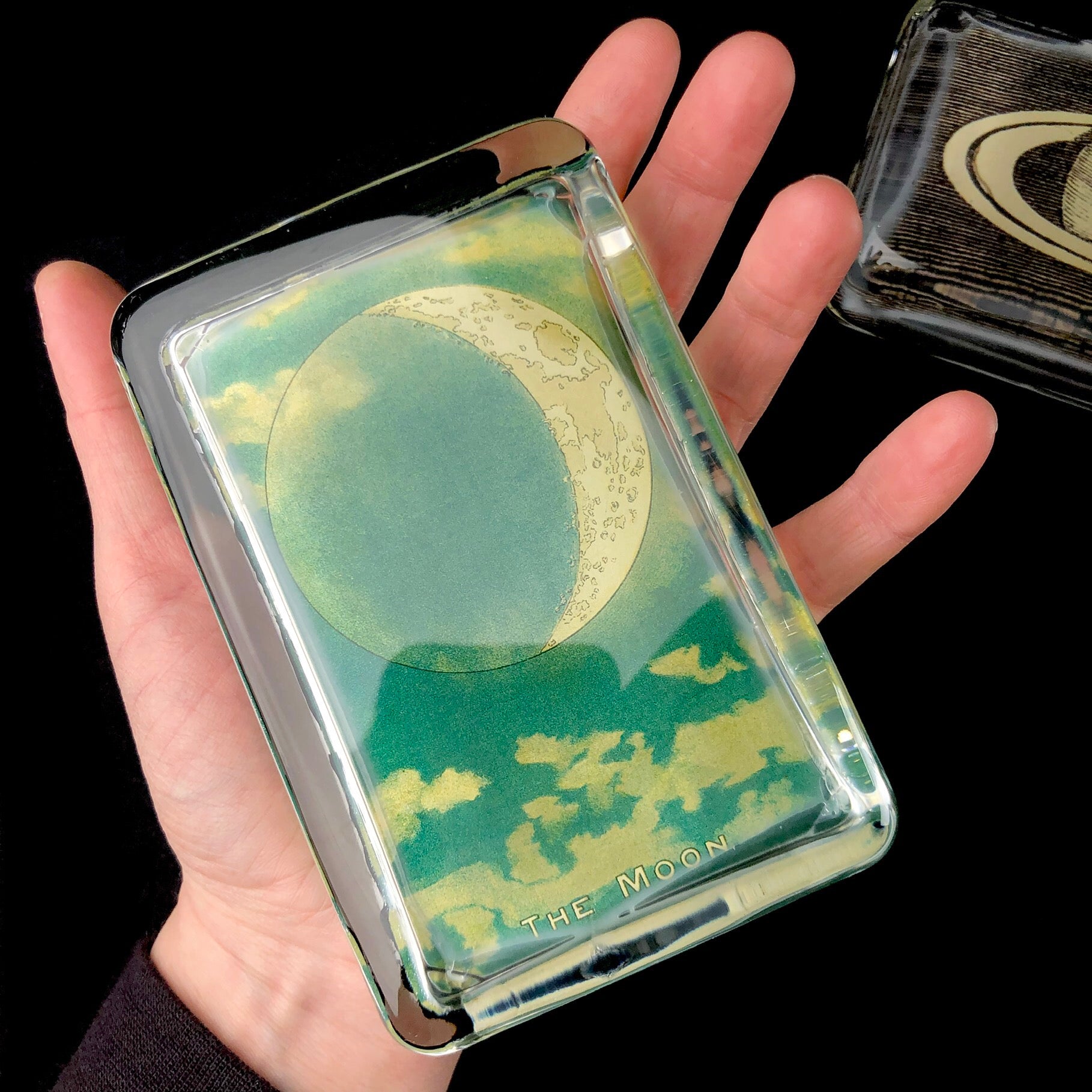 The Moon Paperweight shown in hand