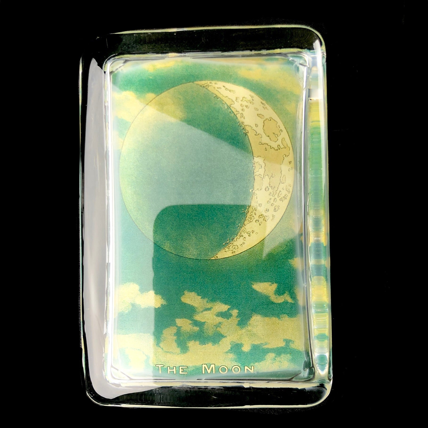 Front view of The Moon Paperweight
