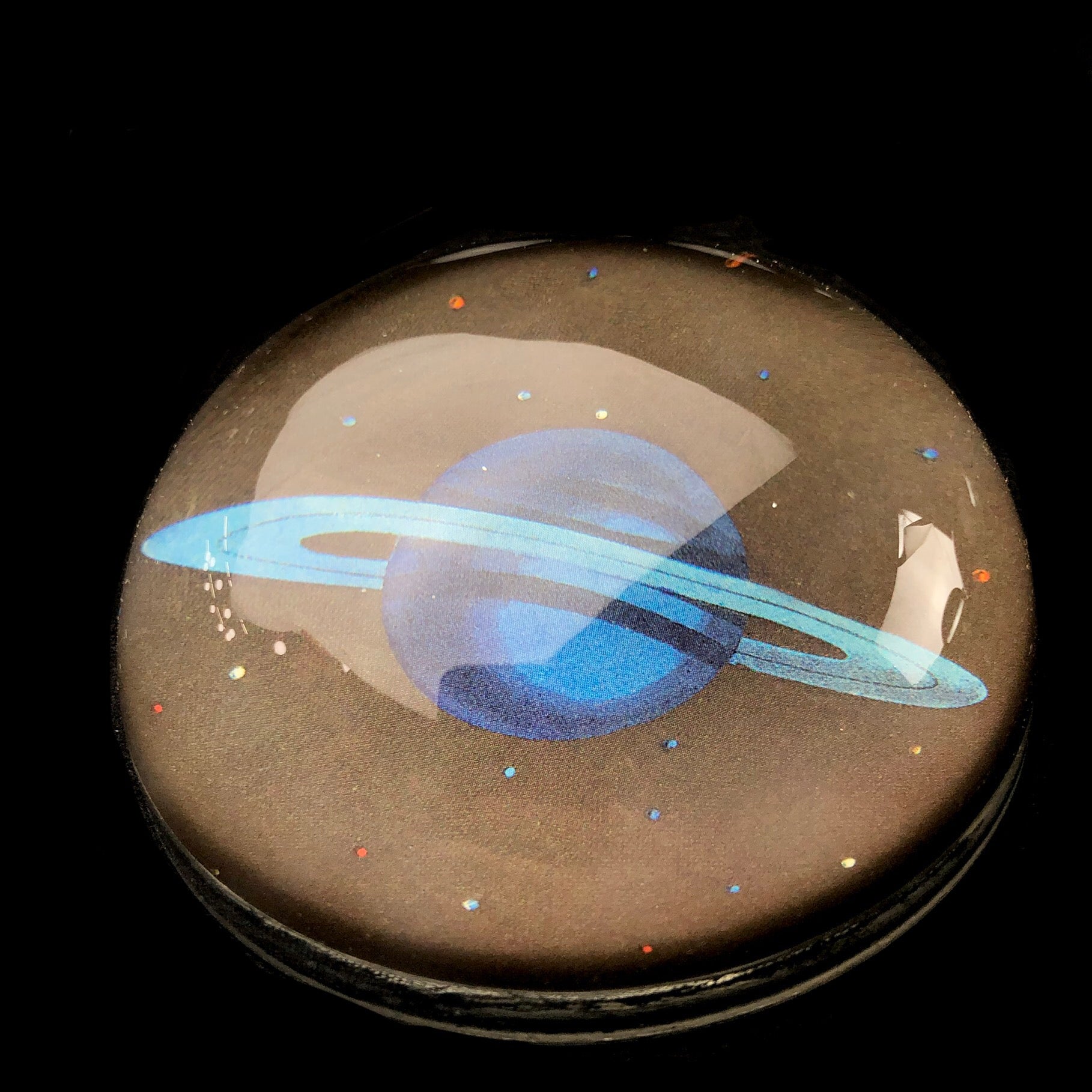 Front view of Blue Saturn Paperwight