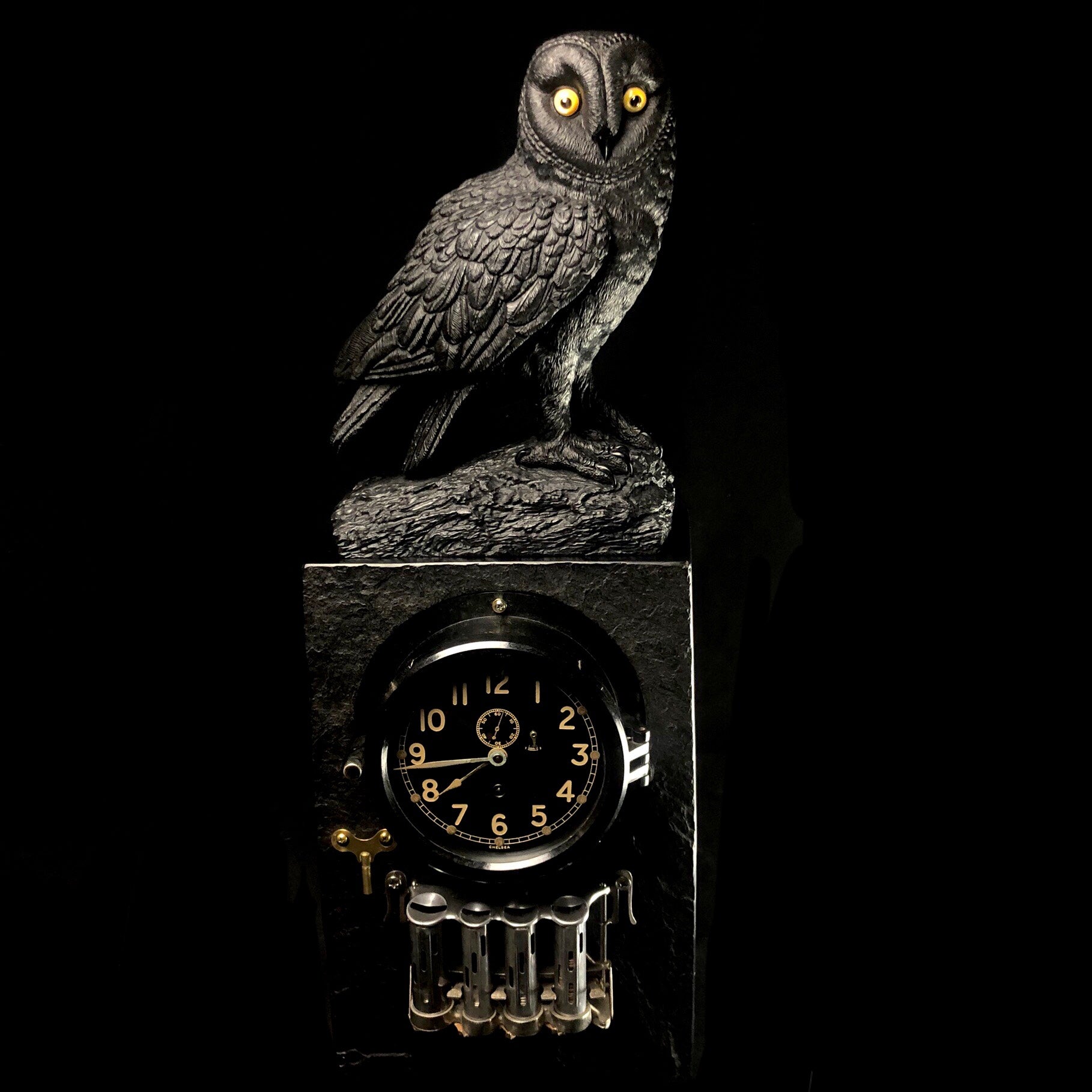 Front view of Wisdom, Time and Change Owl Jet Carving