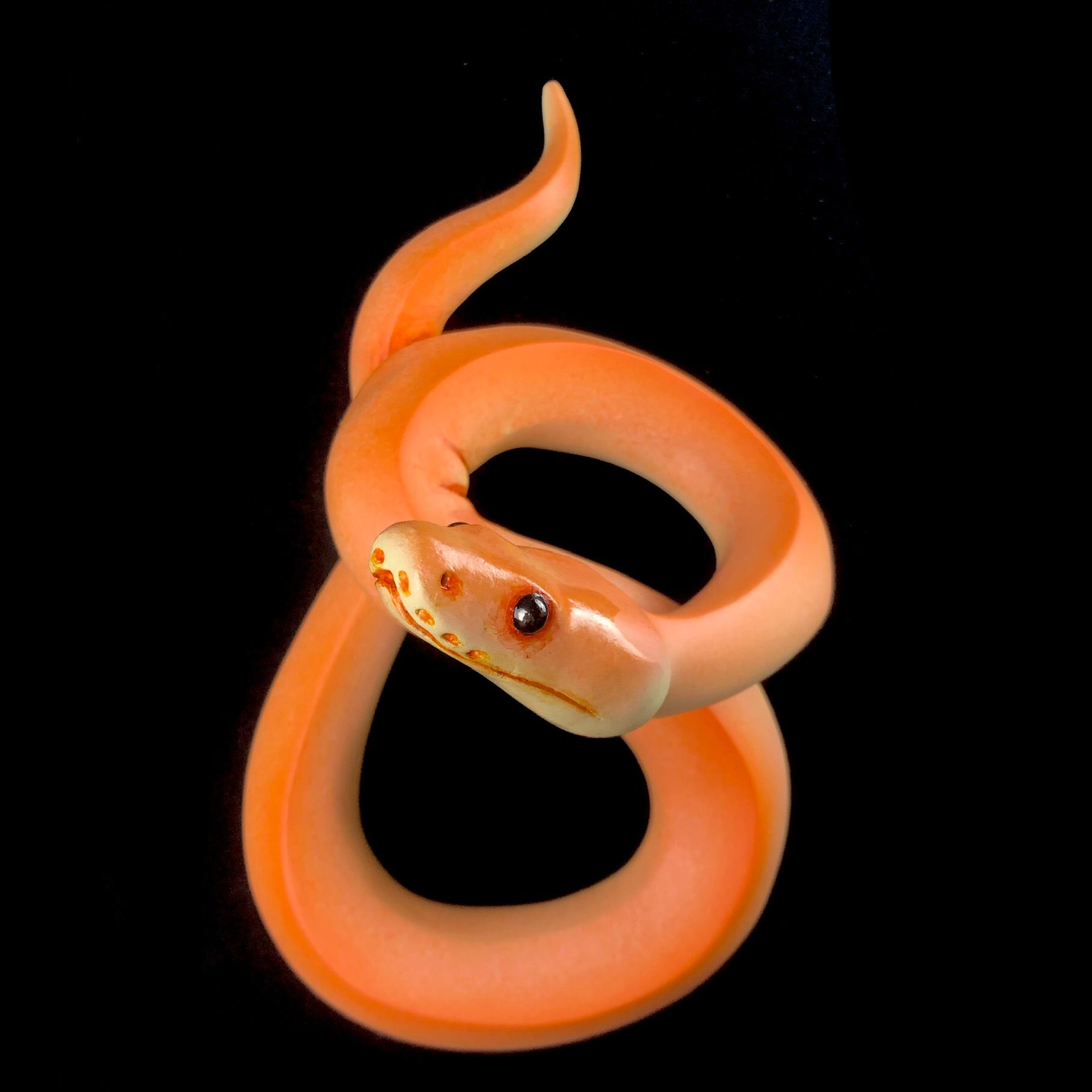 Front view of Orange Wall Hanging Snake Sculpture
