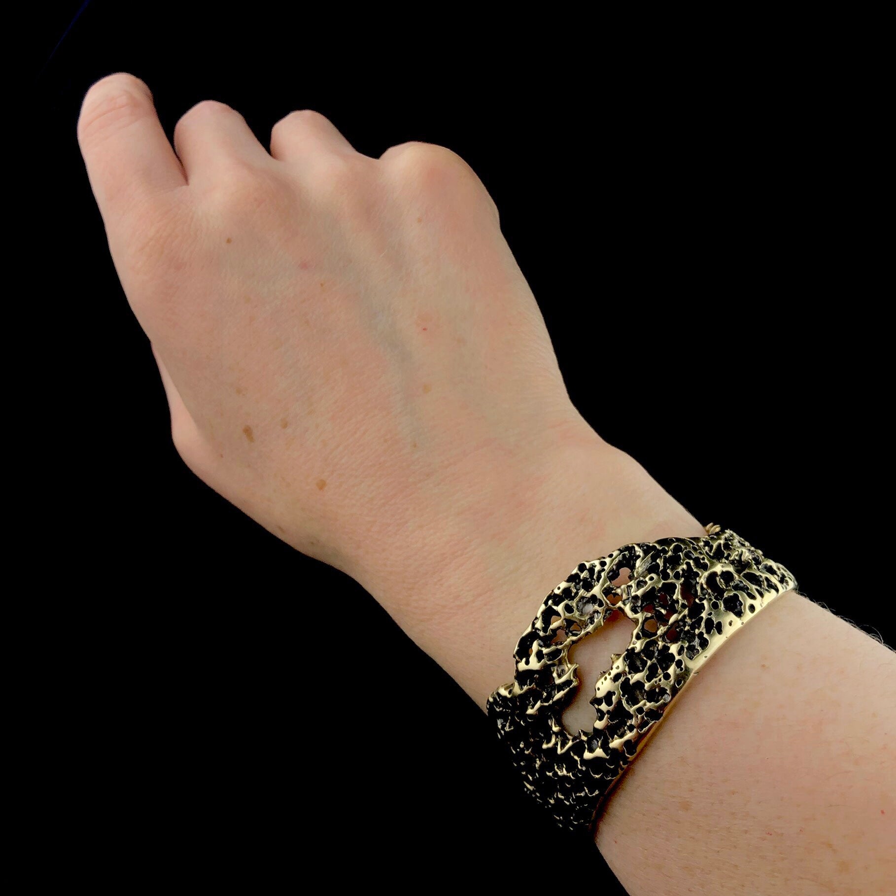 Atoll brass cuff shown and arm
