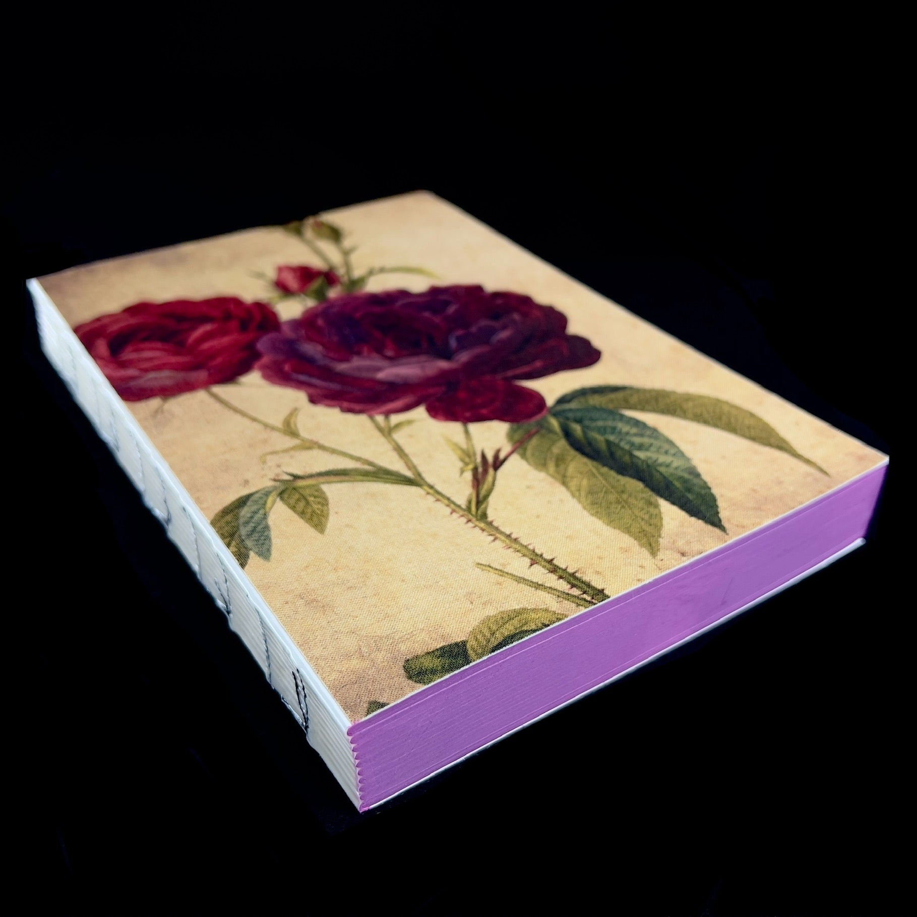 Side view of binding and purple page borders of Rose Journal