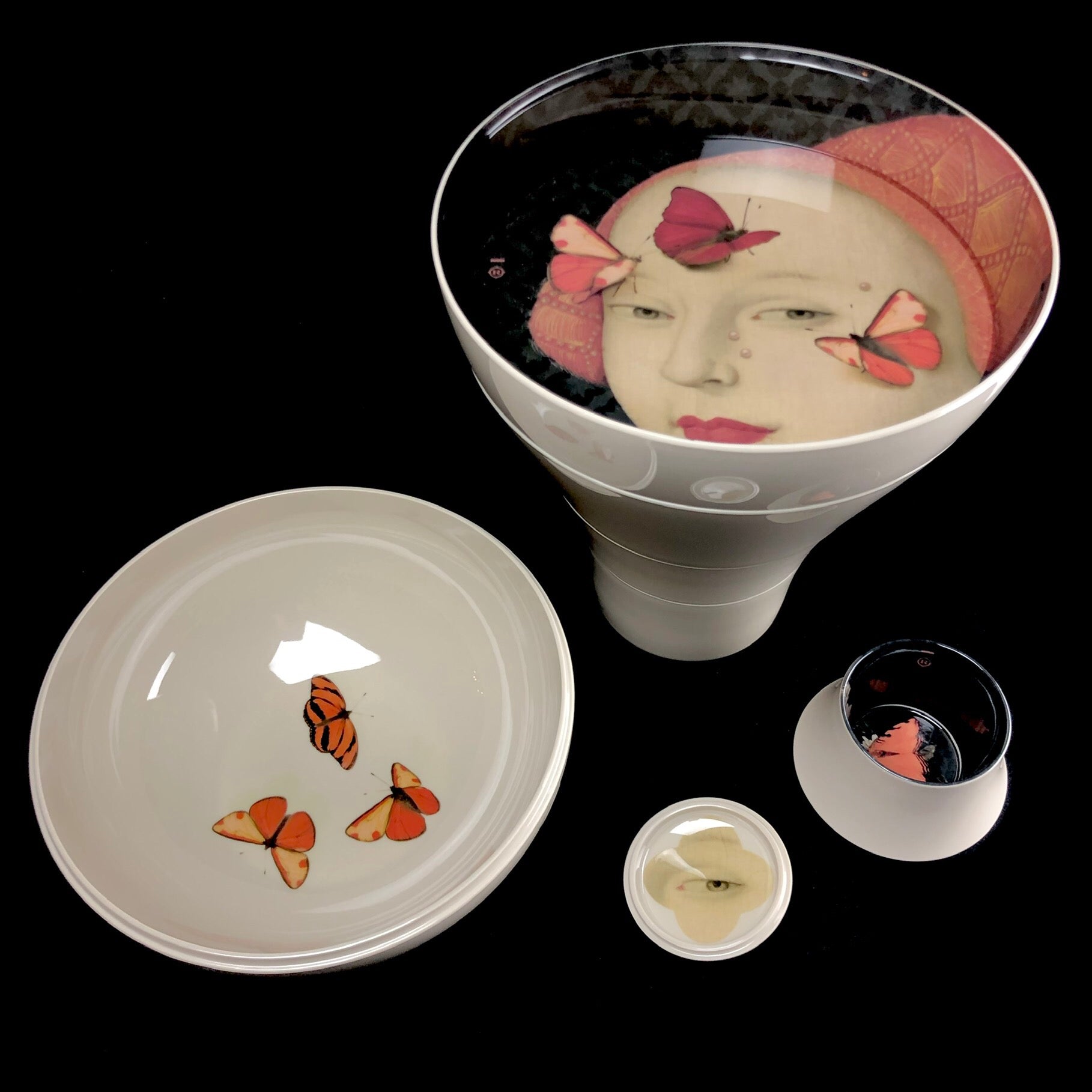 Ming Dishware set half deconstructed with face of young woman inside