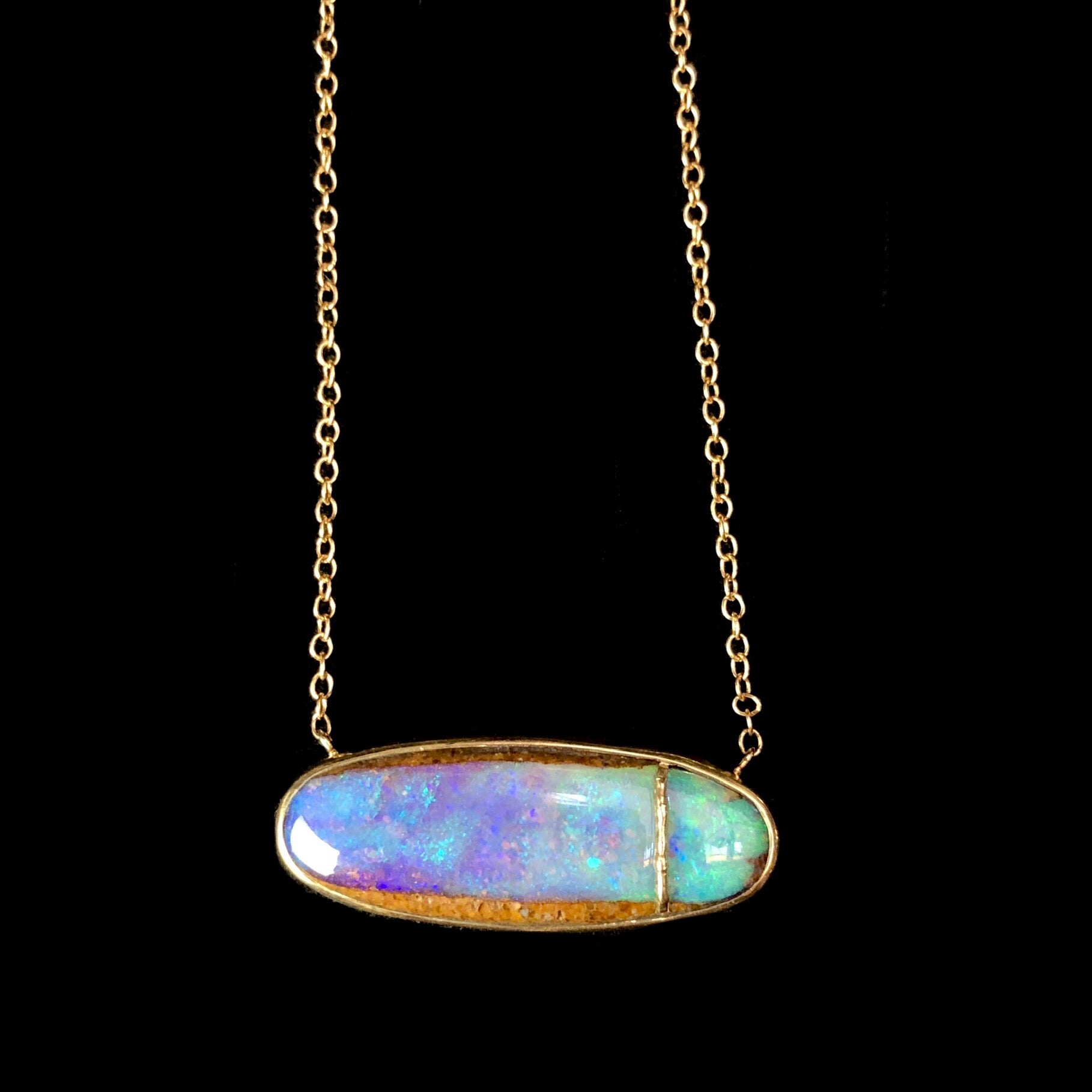 Close up of Opalized Wood Necklace pendant