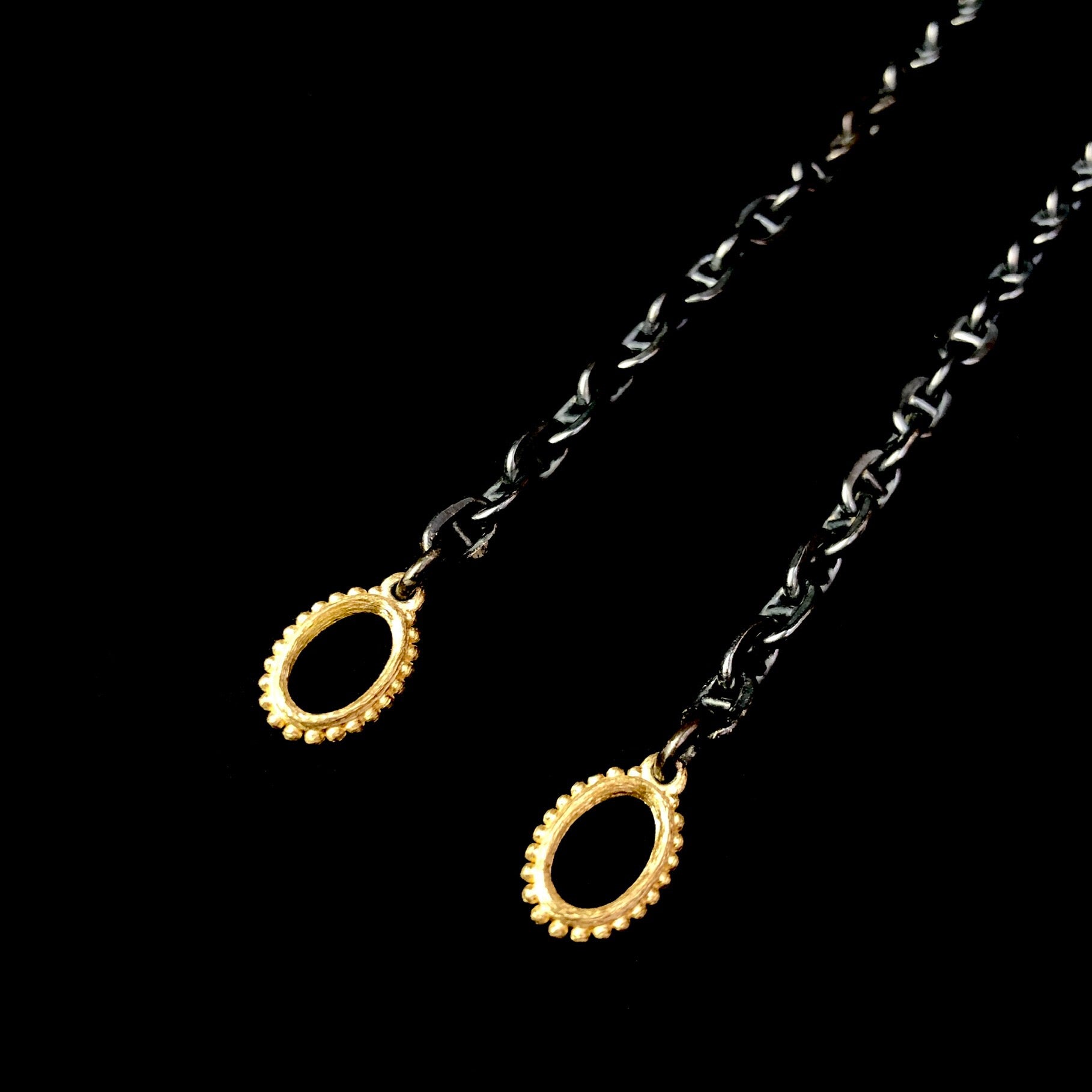 Detail view of Gold Oval Accents at end of Oxidized Anchor Chain