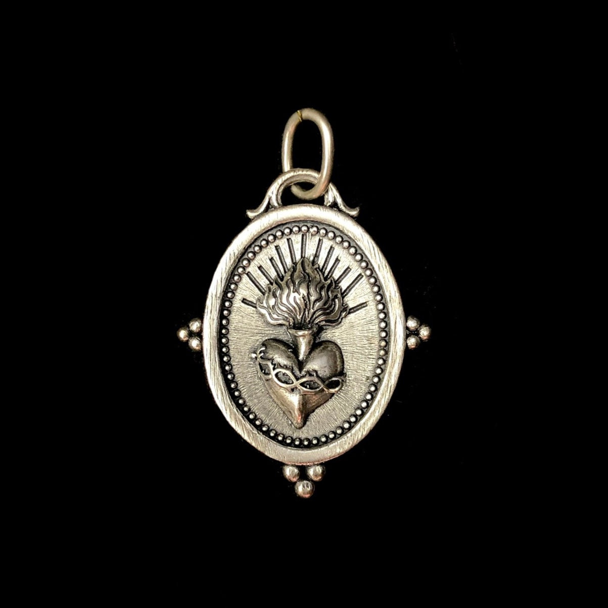 Front view of silver Sacred Heart Charm