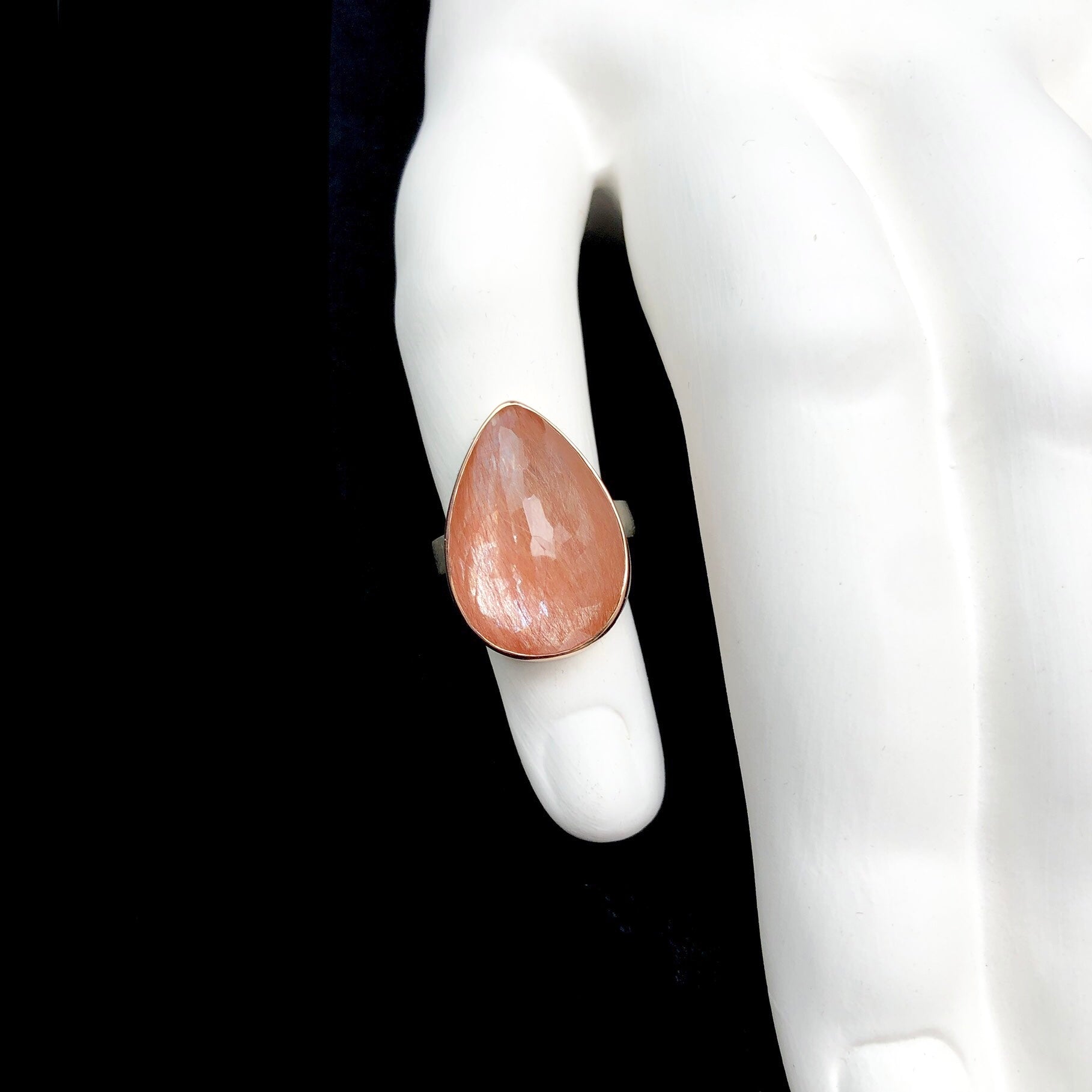 Red Rutilated Quartz Ring on sculpted white ceramic finger