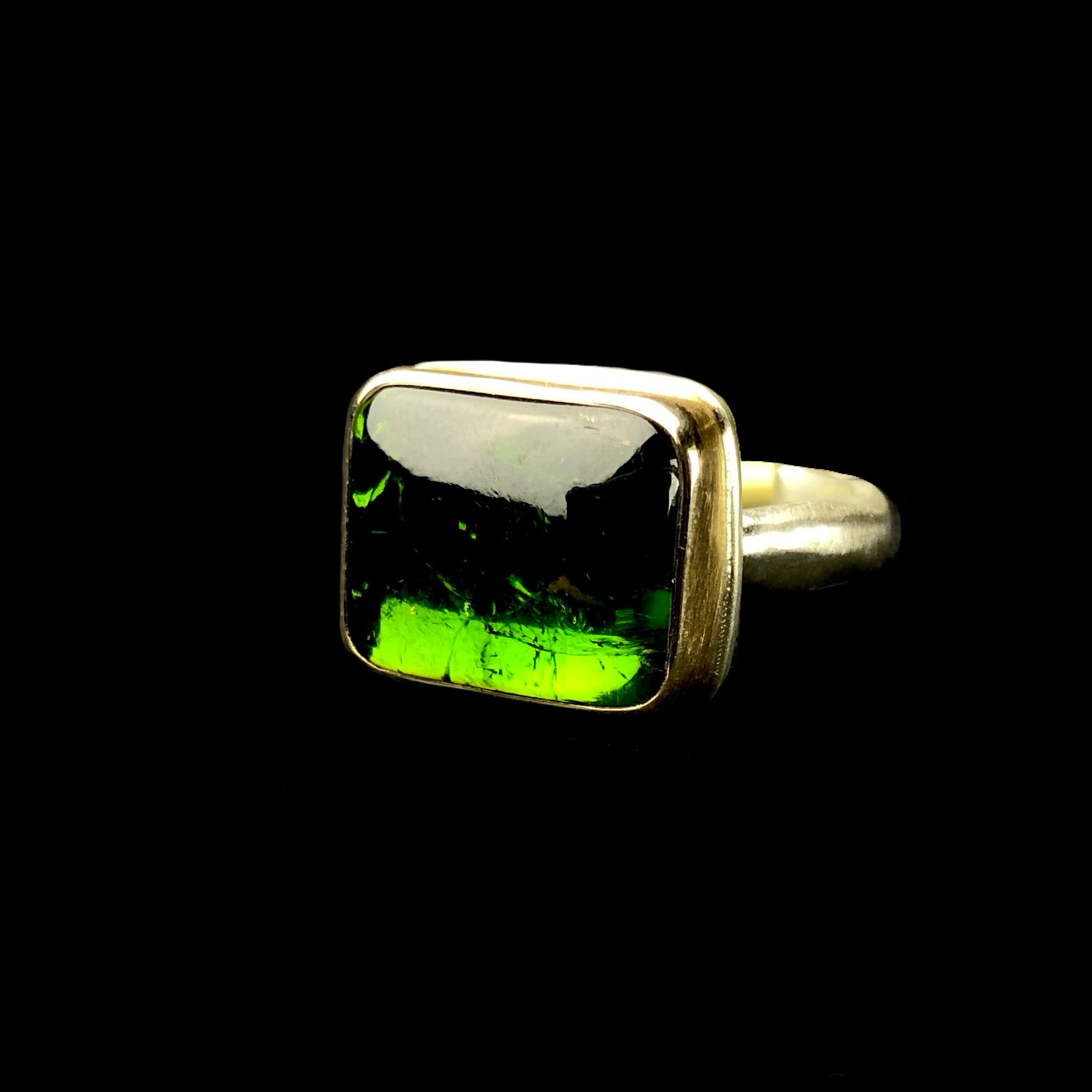 Front side view of smooth, rectangular shaped Green Tourmaline ring