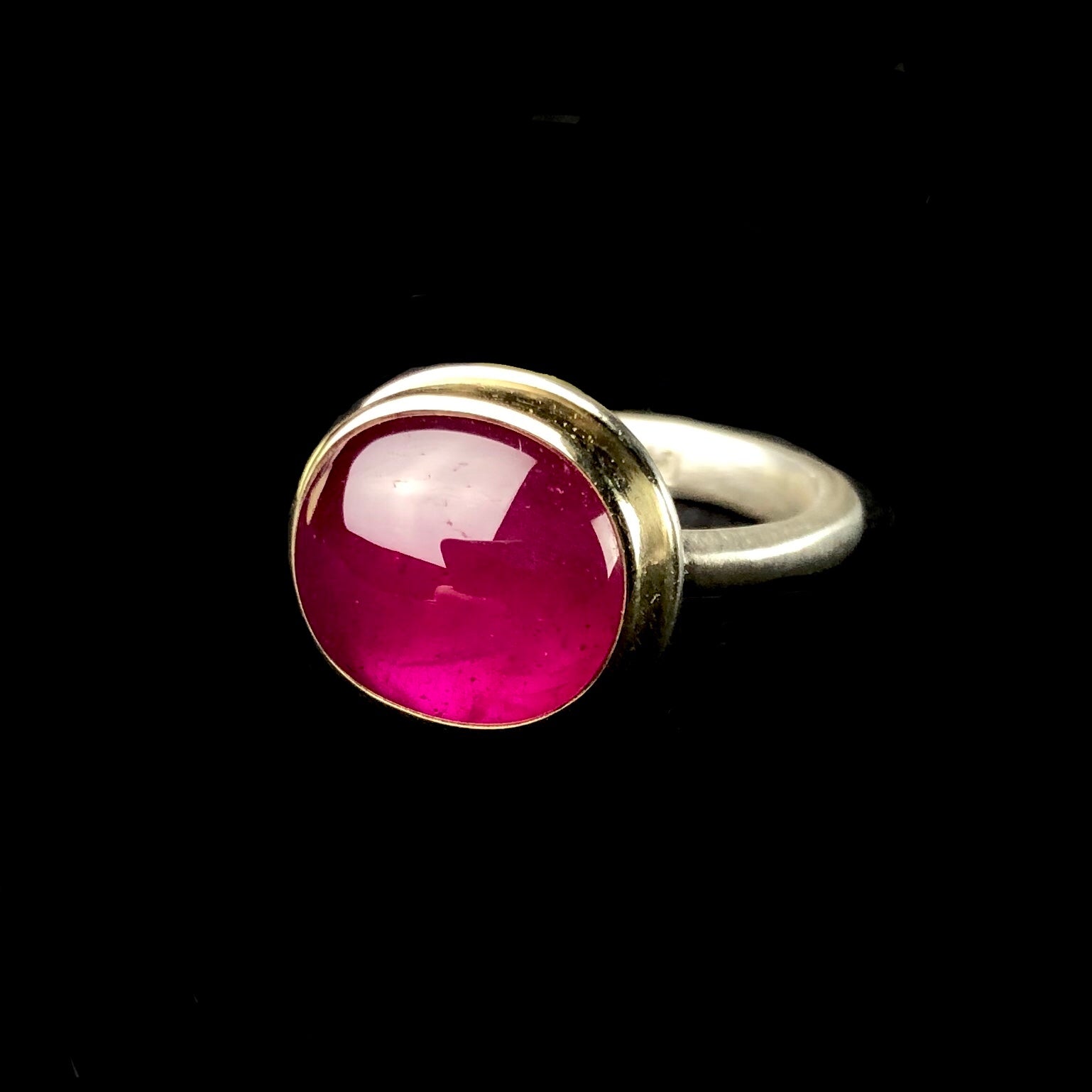 Oval shaped, vibrant pink ruby stone ring