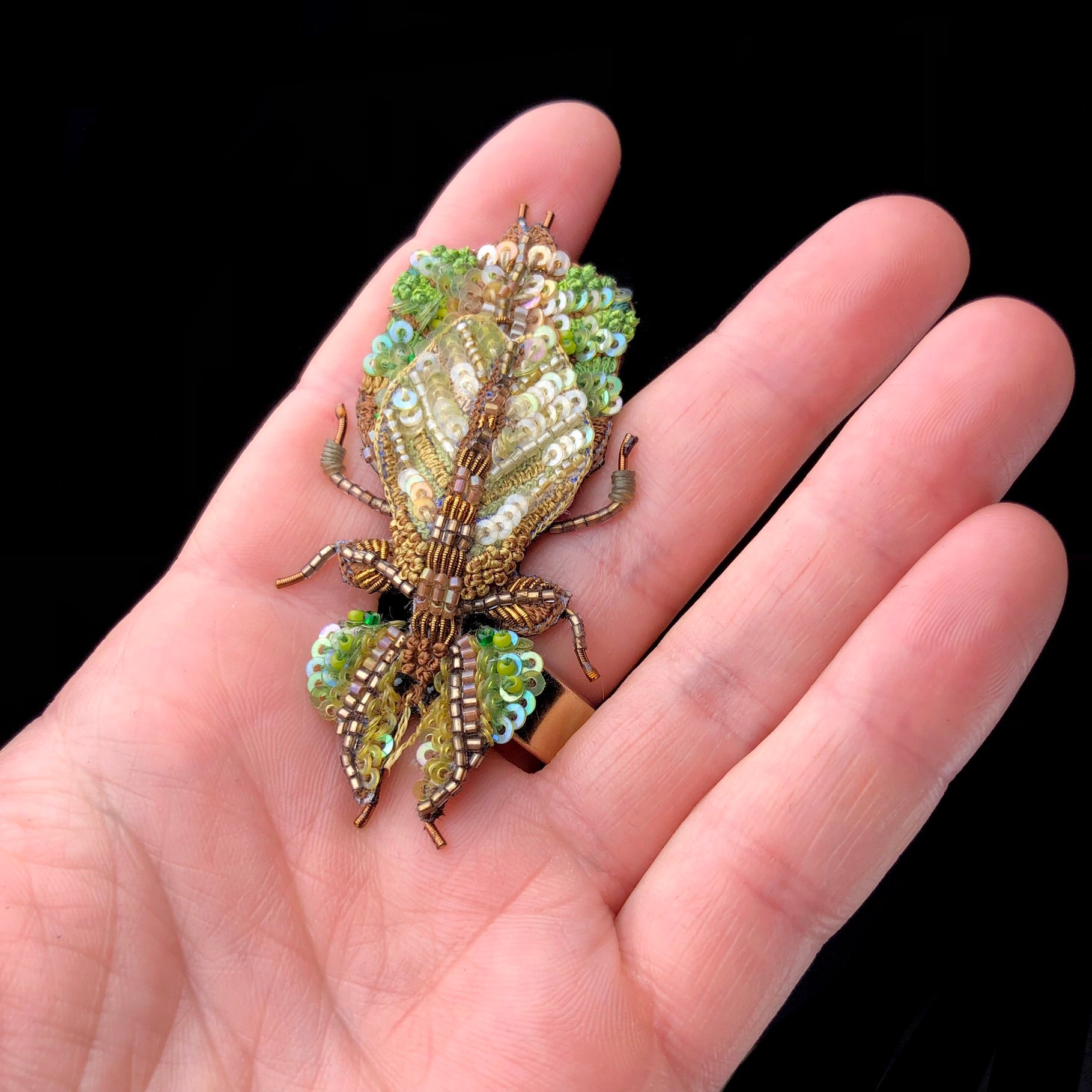 Leaf Bug Pin Brooch shown in hand