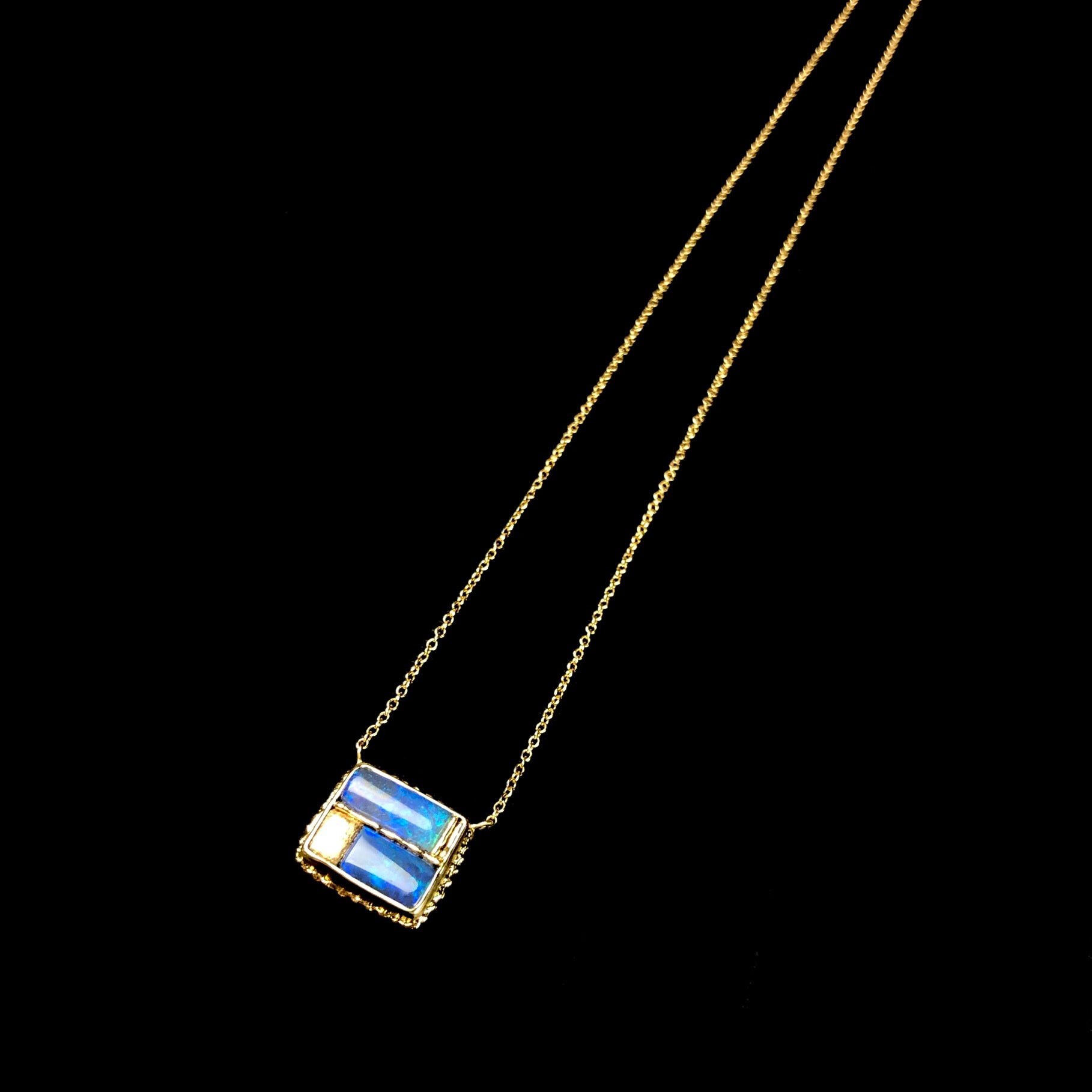 Side view of Opal Mosaic Necklace with ruffled edge of gold setting