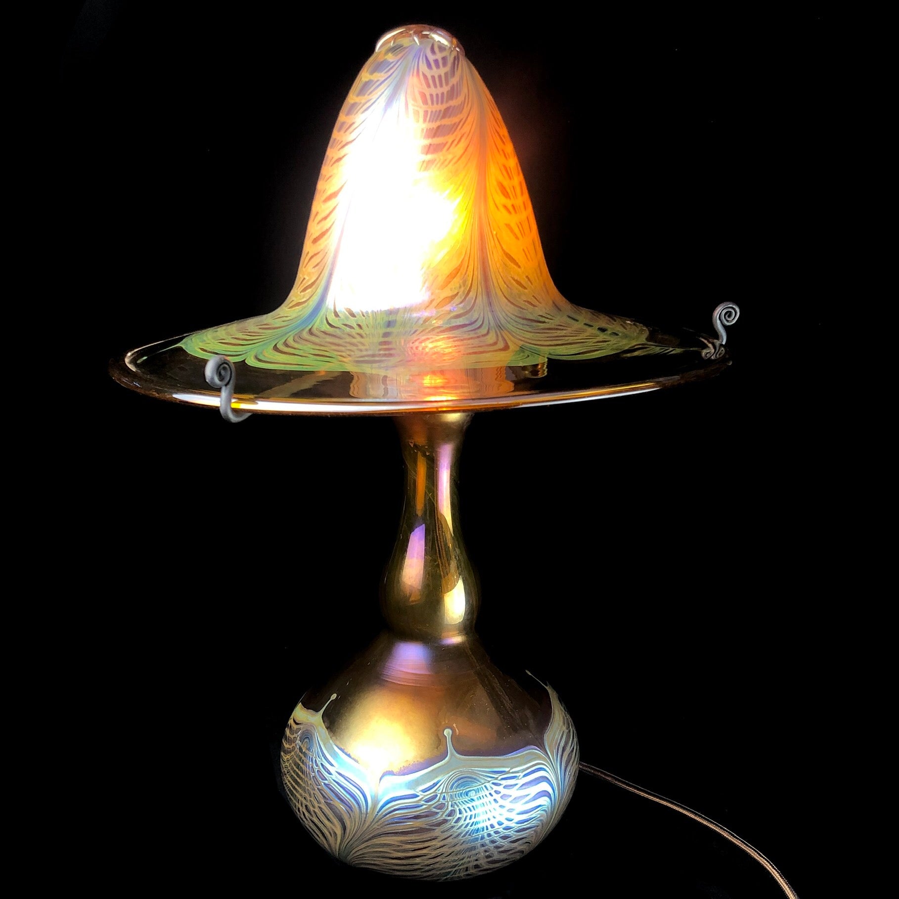 Front view of Amber Glass Cathedral Lamp with light illuminated
