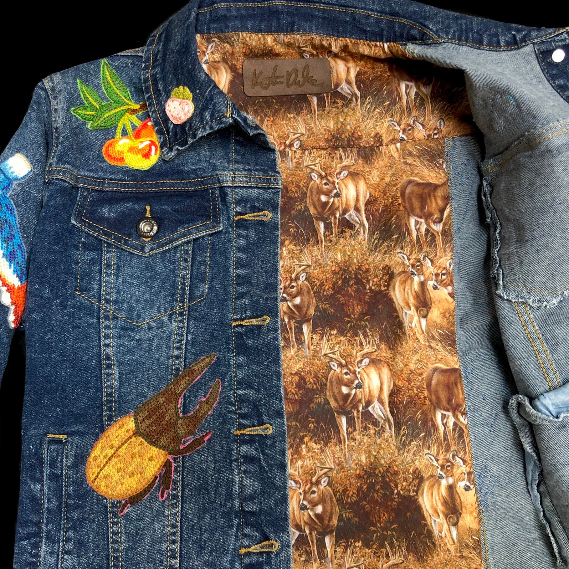 Inner lining fabric showing deer in a field of Beetle jean Jacket