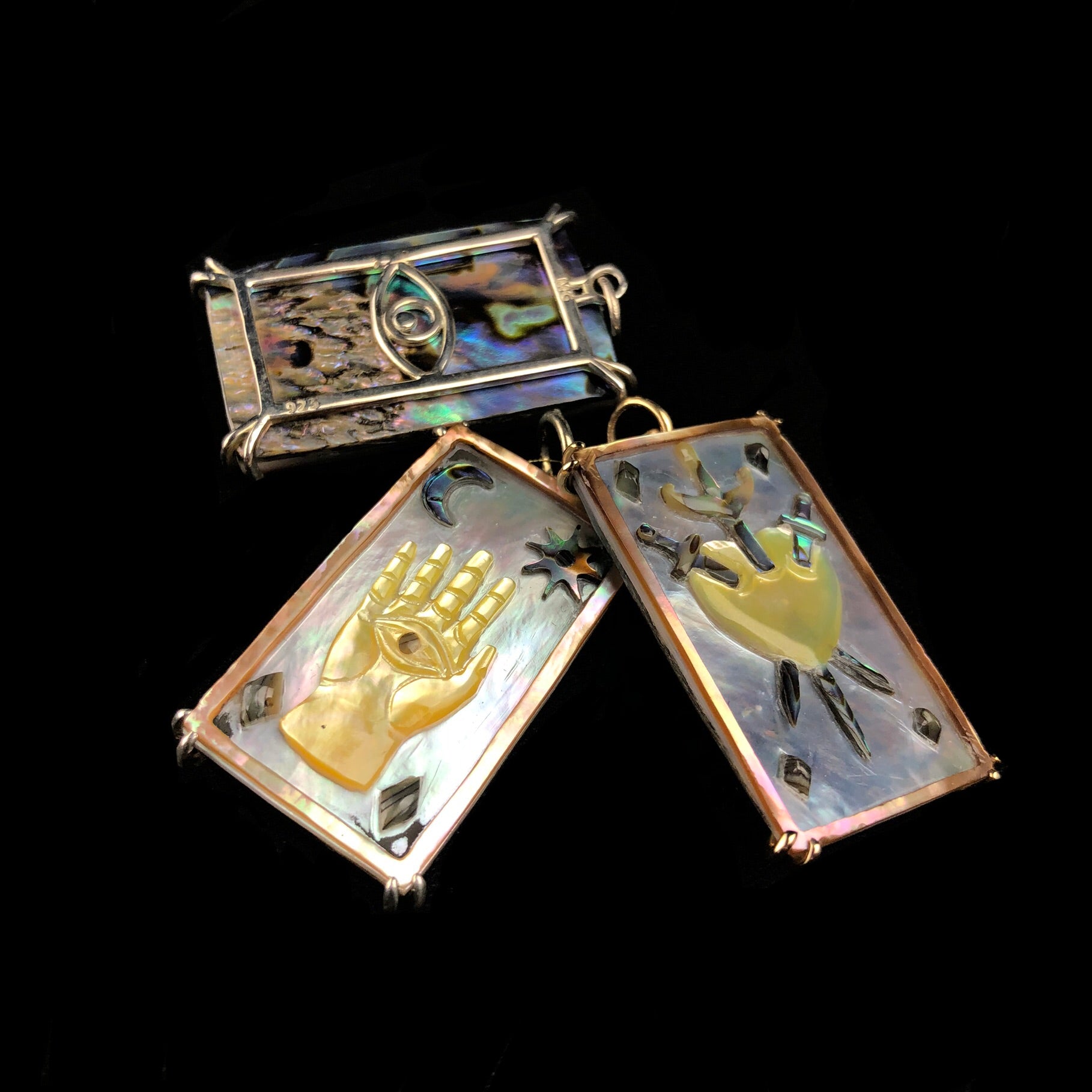 Sacred Hand Tablet Charm shown with two other tablet charms