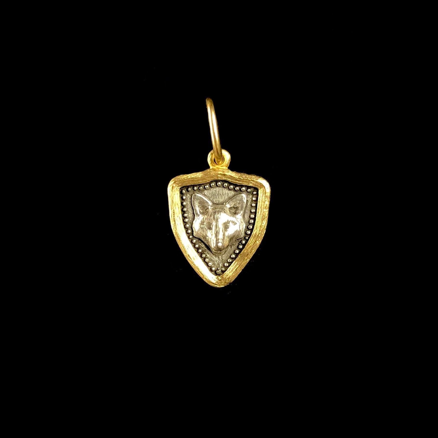 Front side of Fox and Flower Charm with relief of fox head 