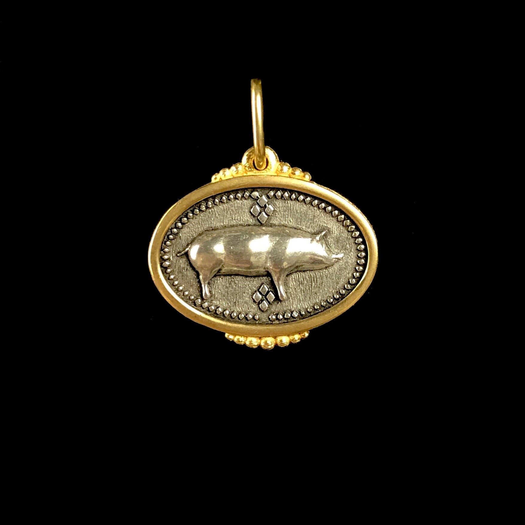 Relief of standing pig in silver with gold frame