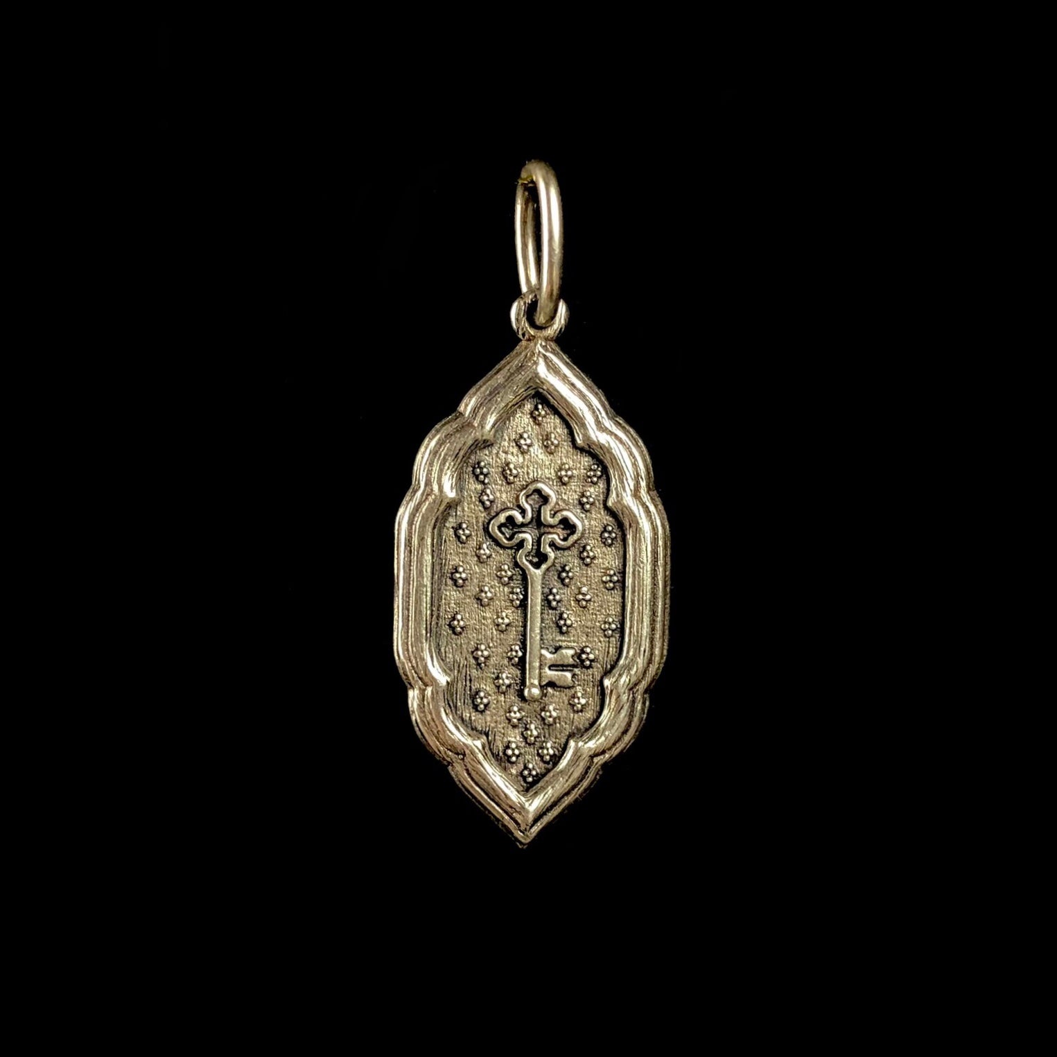 Front side with the relief of a key