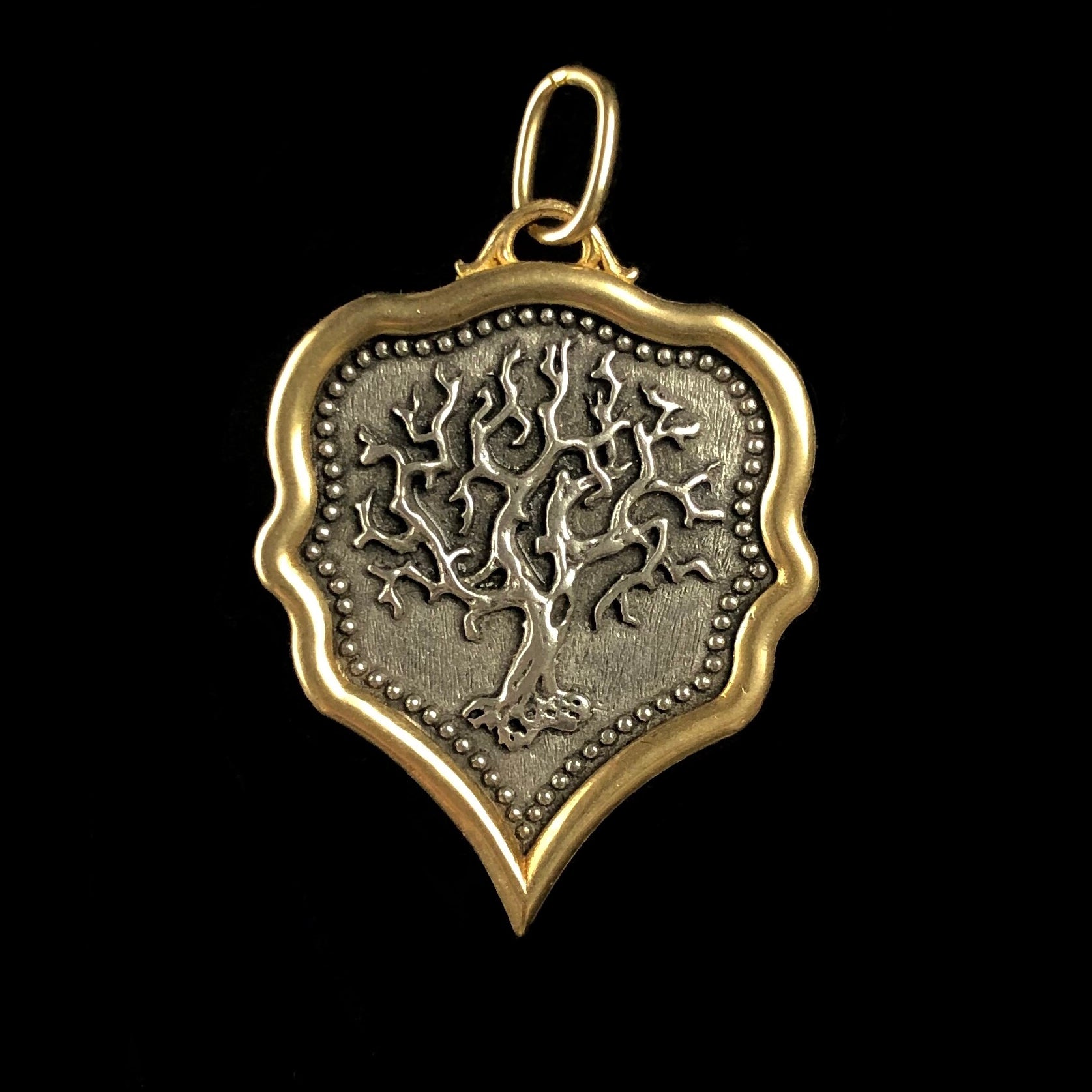 Tree of life with tangled branches on Tree of Life Charm