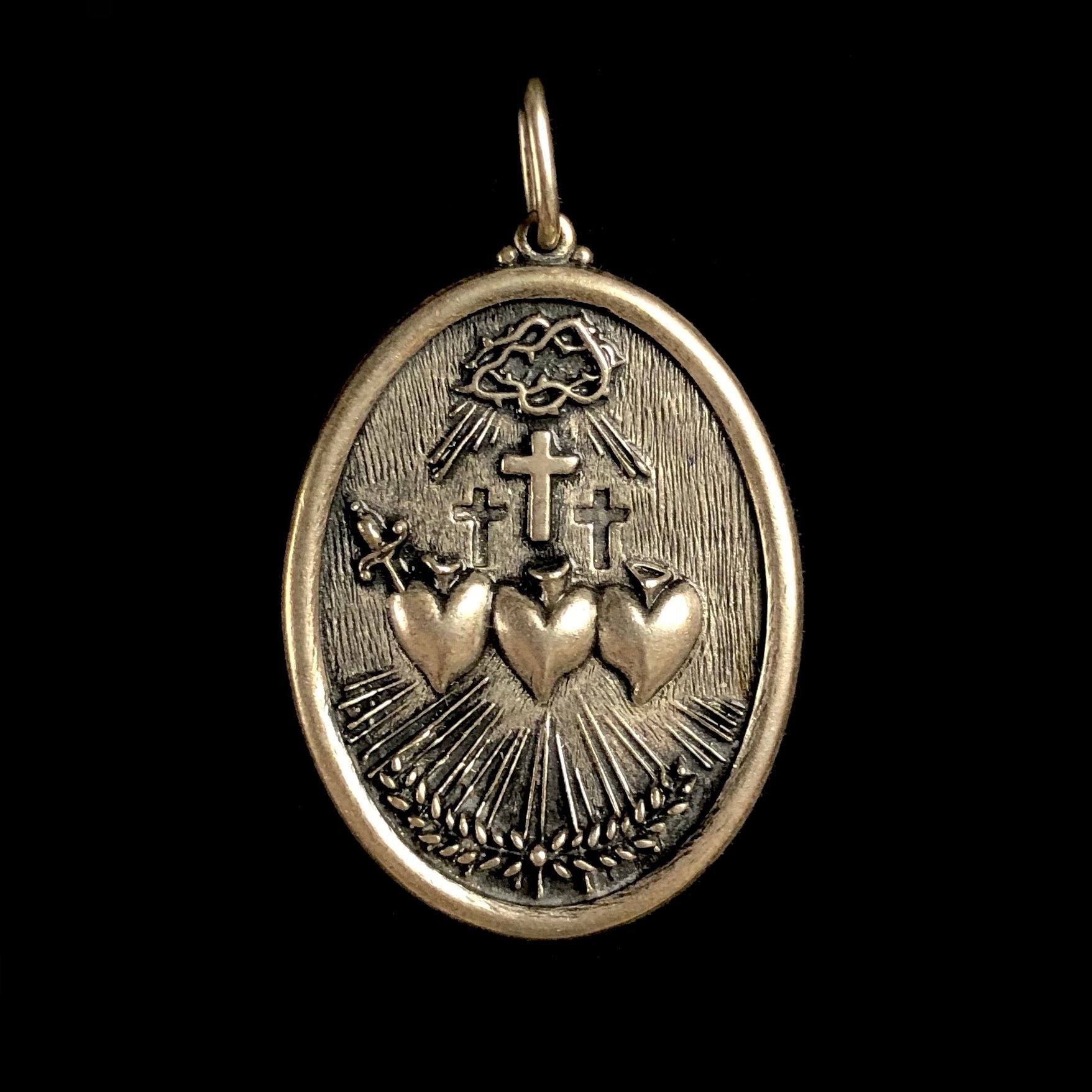 Front side of Triple Sacred Heart Charm 