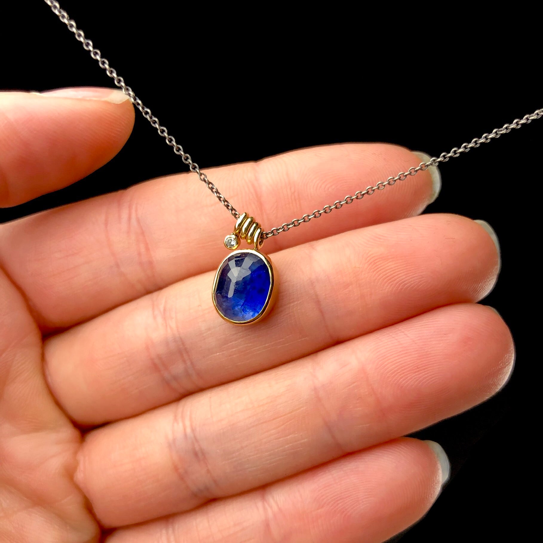 Blue Sapphire Gem Necklace shown in hand