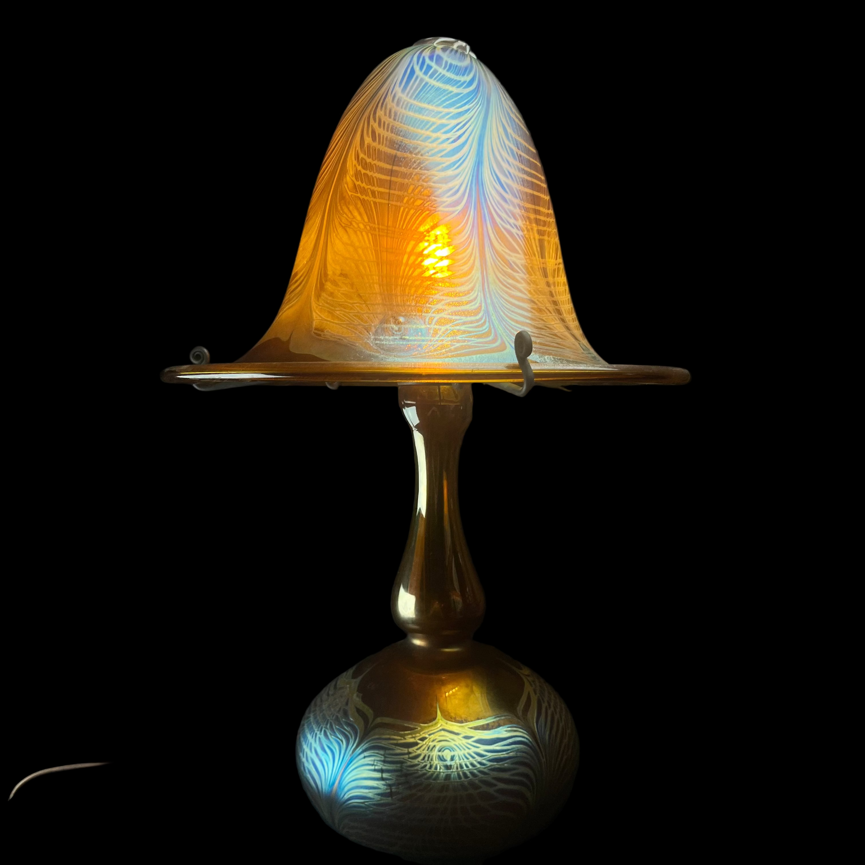 Decorative lamp with intricate design on a dark background