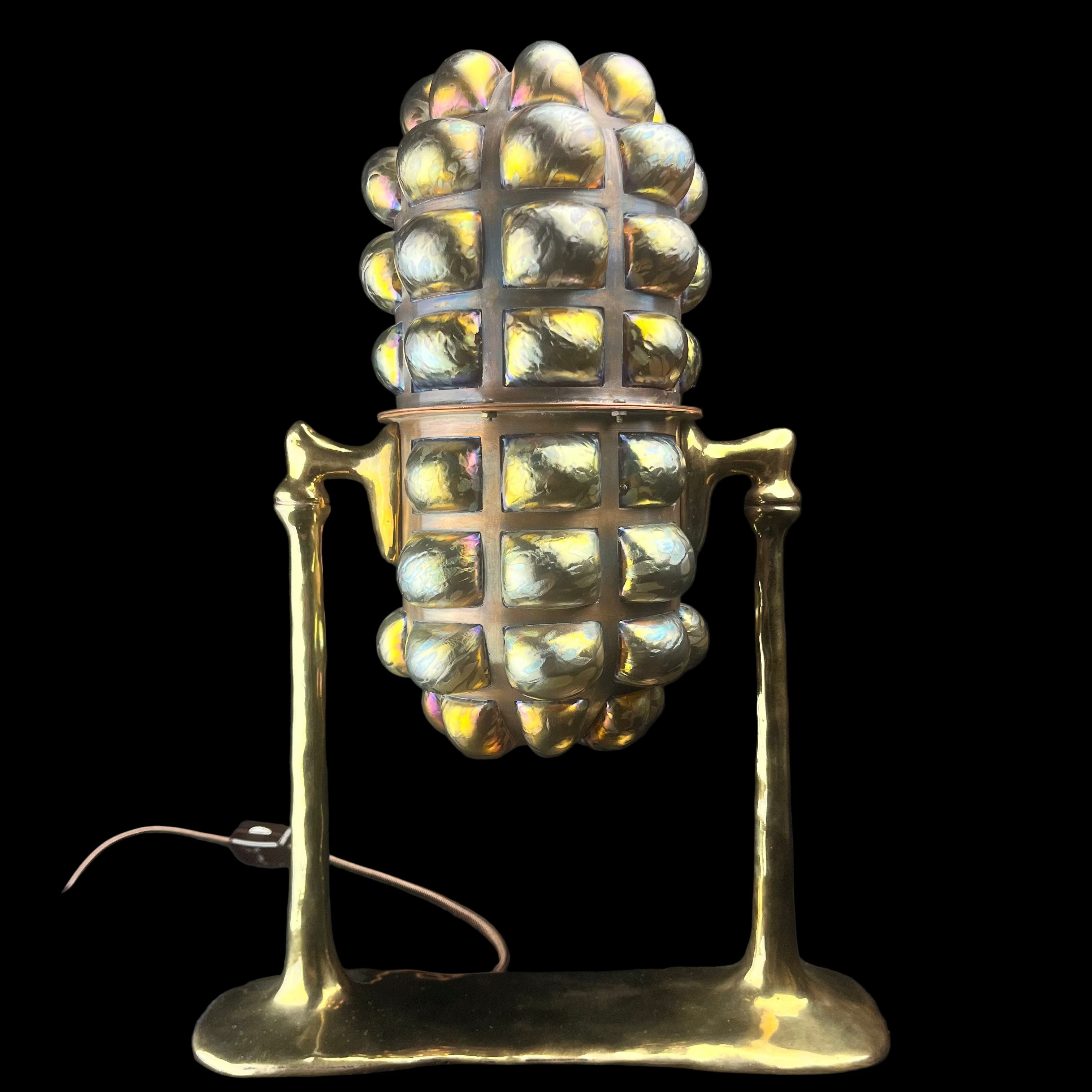 Gold vintage-style microphone on a black background