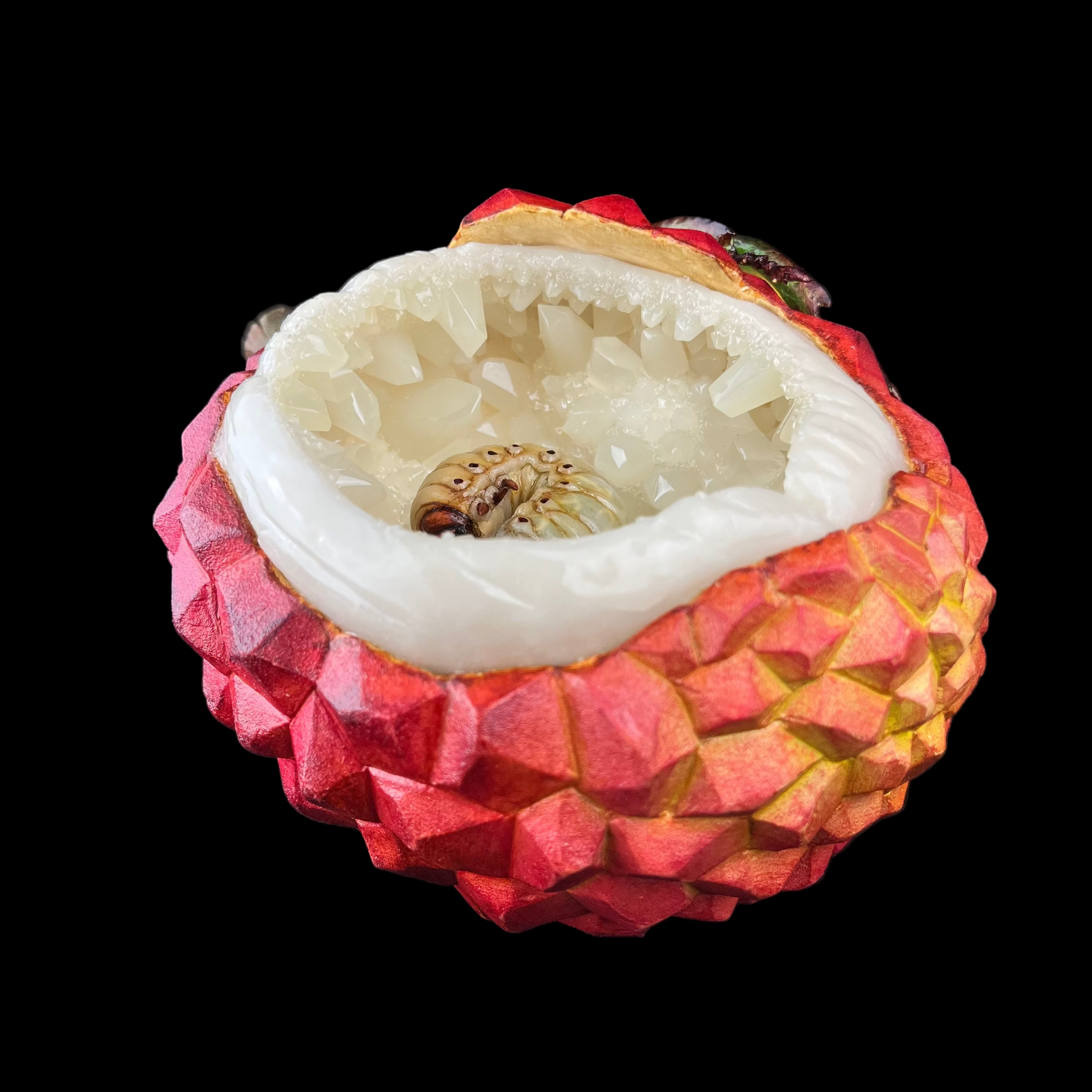Lychee fruit with a ring inside on a black background