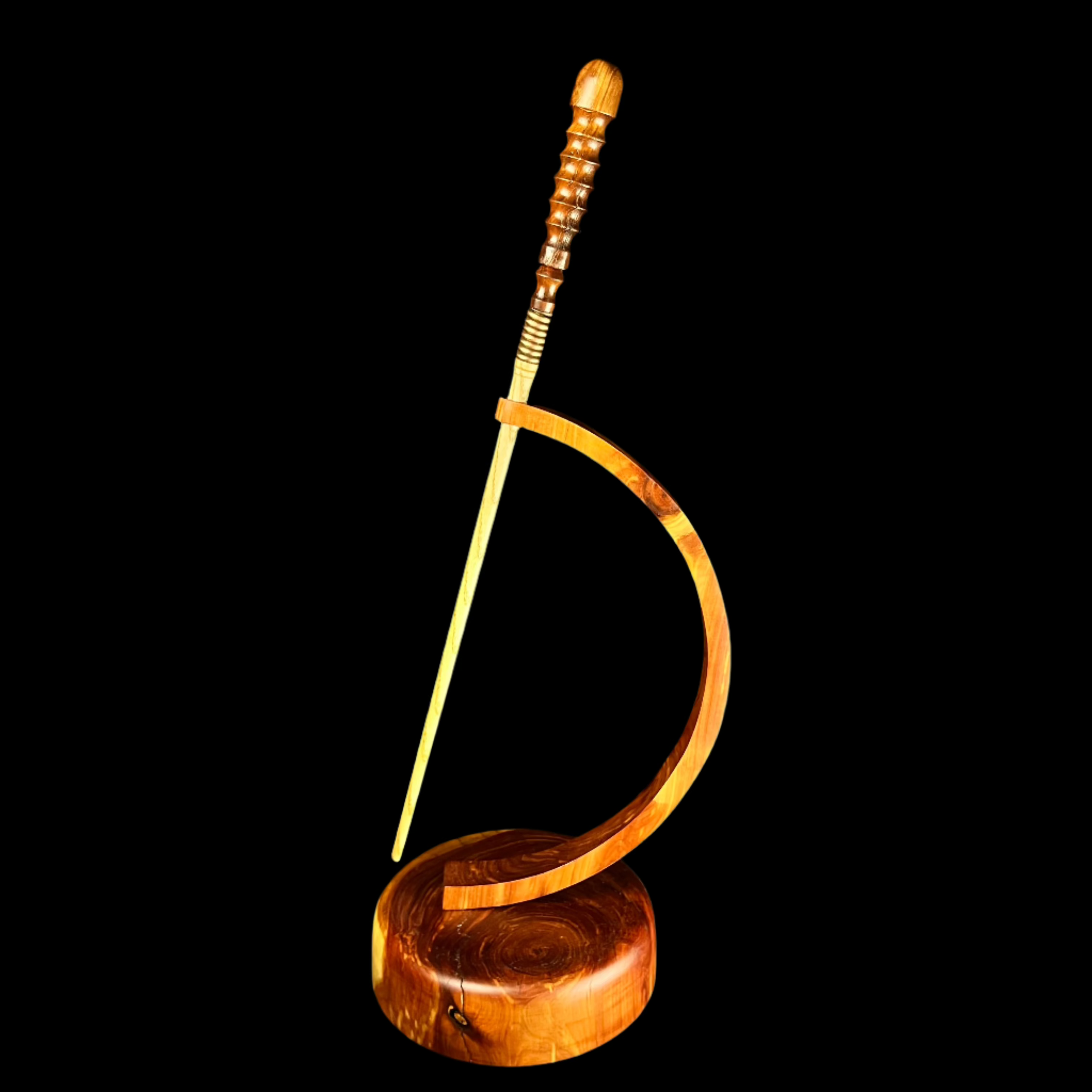 Light wooden wand standing in red wood stand