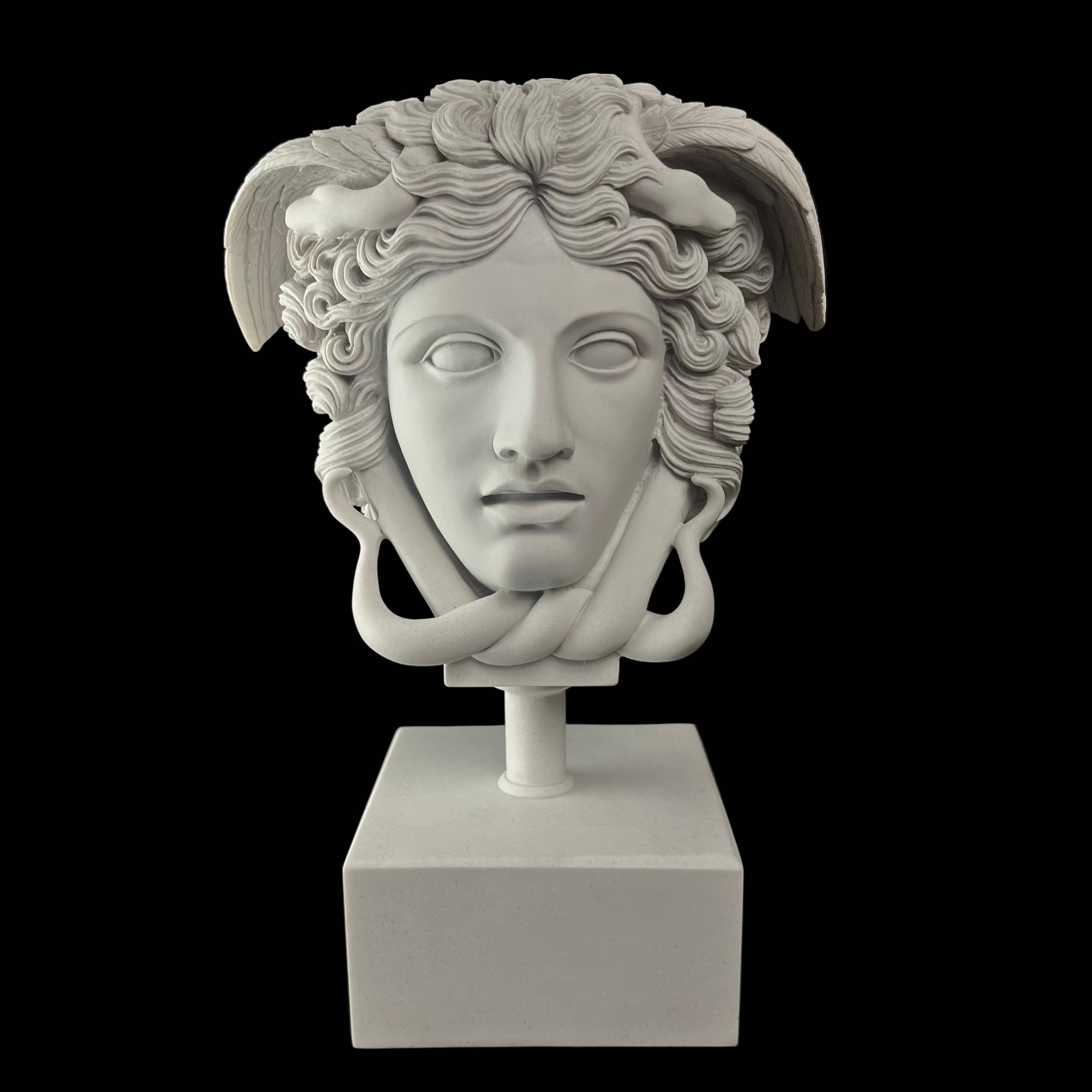 White marble sculpture of a classical head on a black background