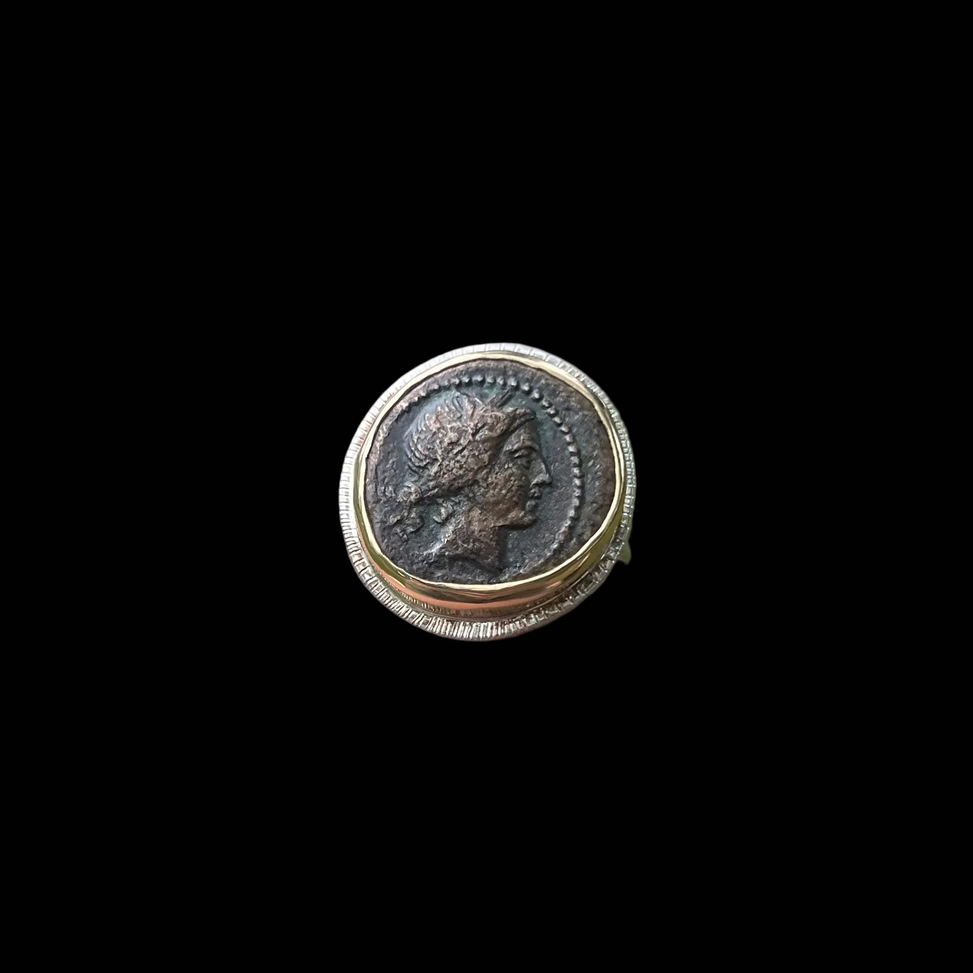 Coin ring shown on black background