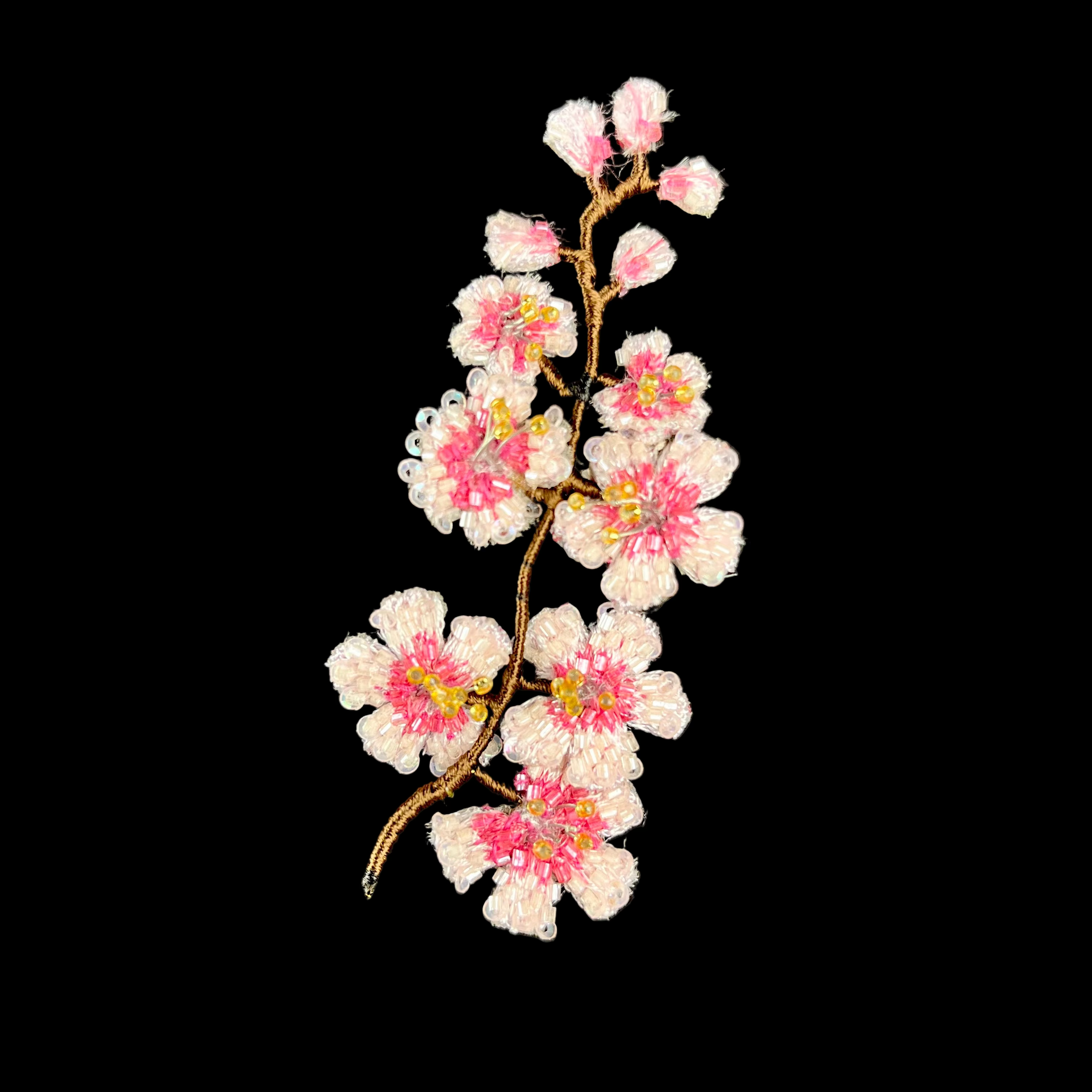 Embroidered cherry blossom branch on a black background