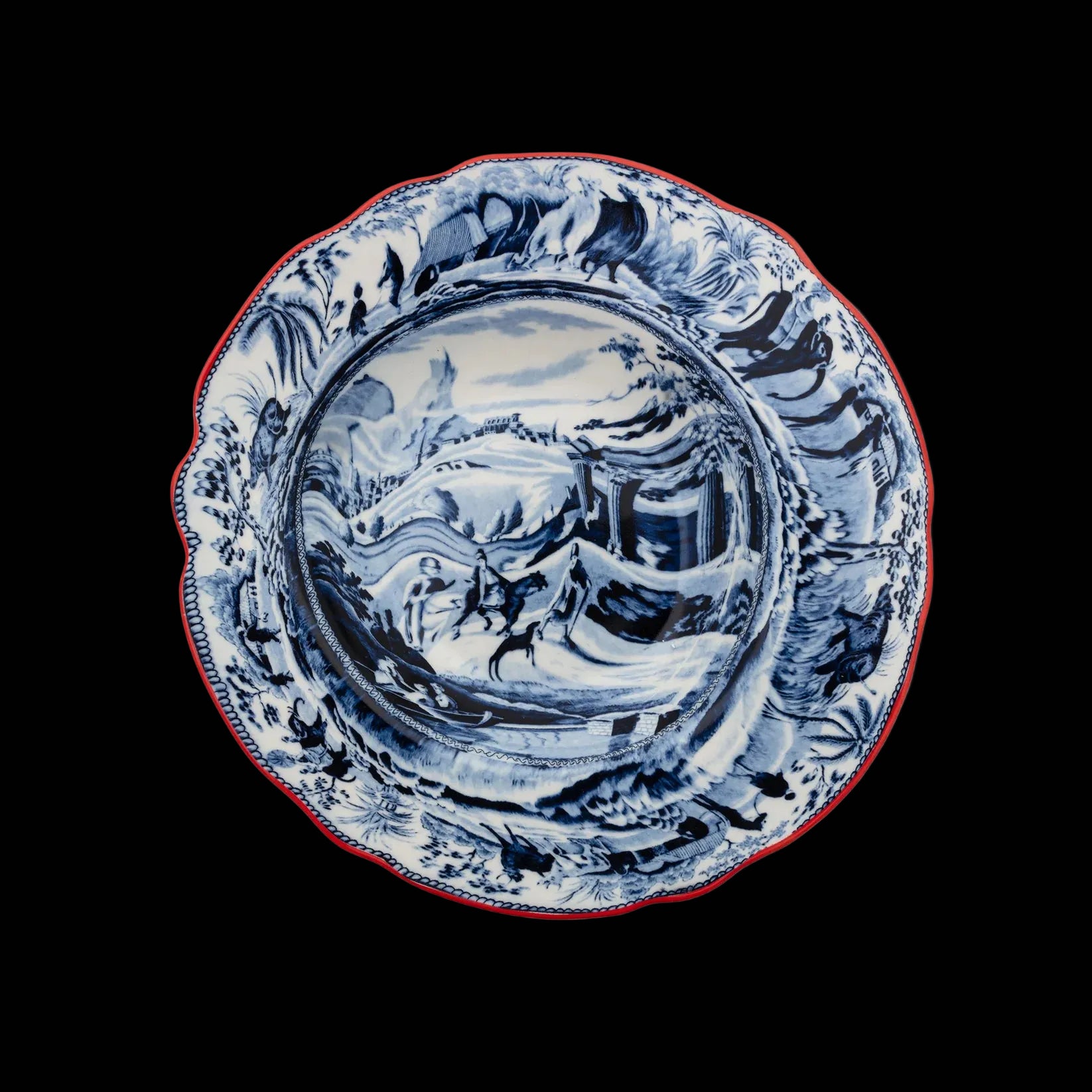 Blue and white ceramic plate with scenic design on a white background