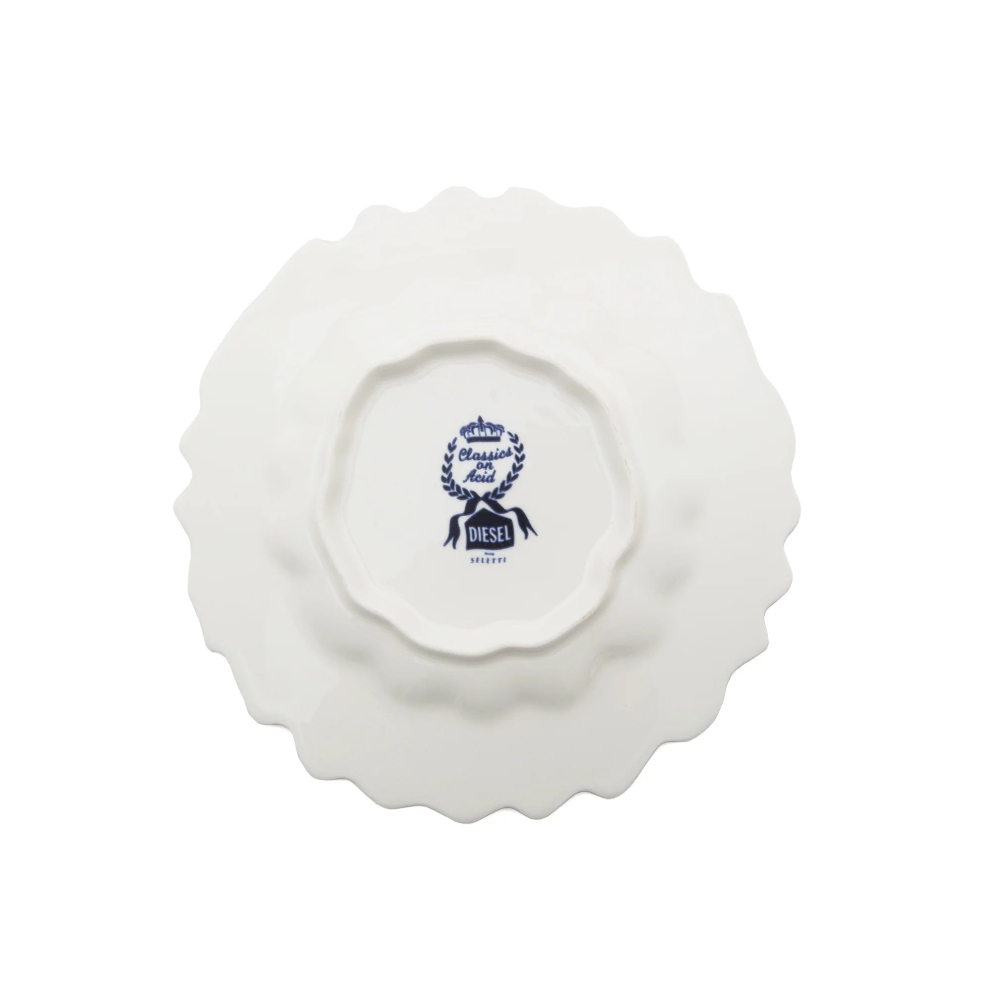 White ceramic plate with a decorative logo on a white background