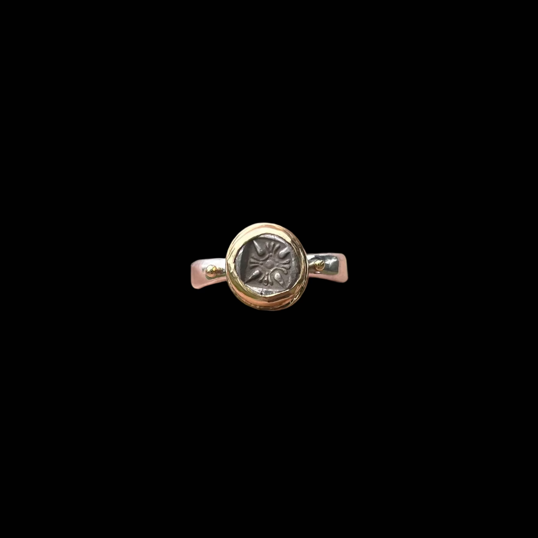 Circular silver ring on black background