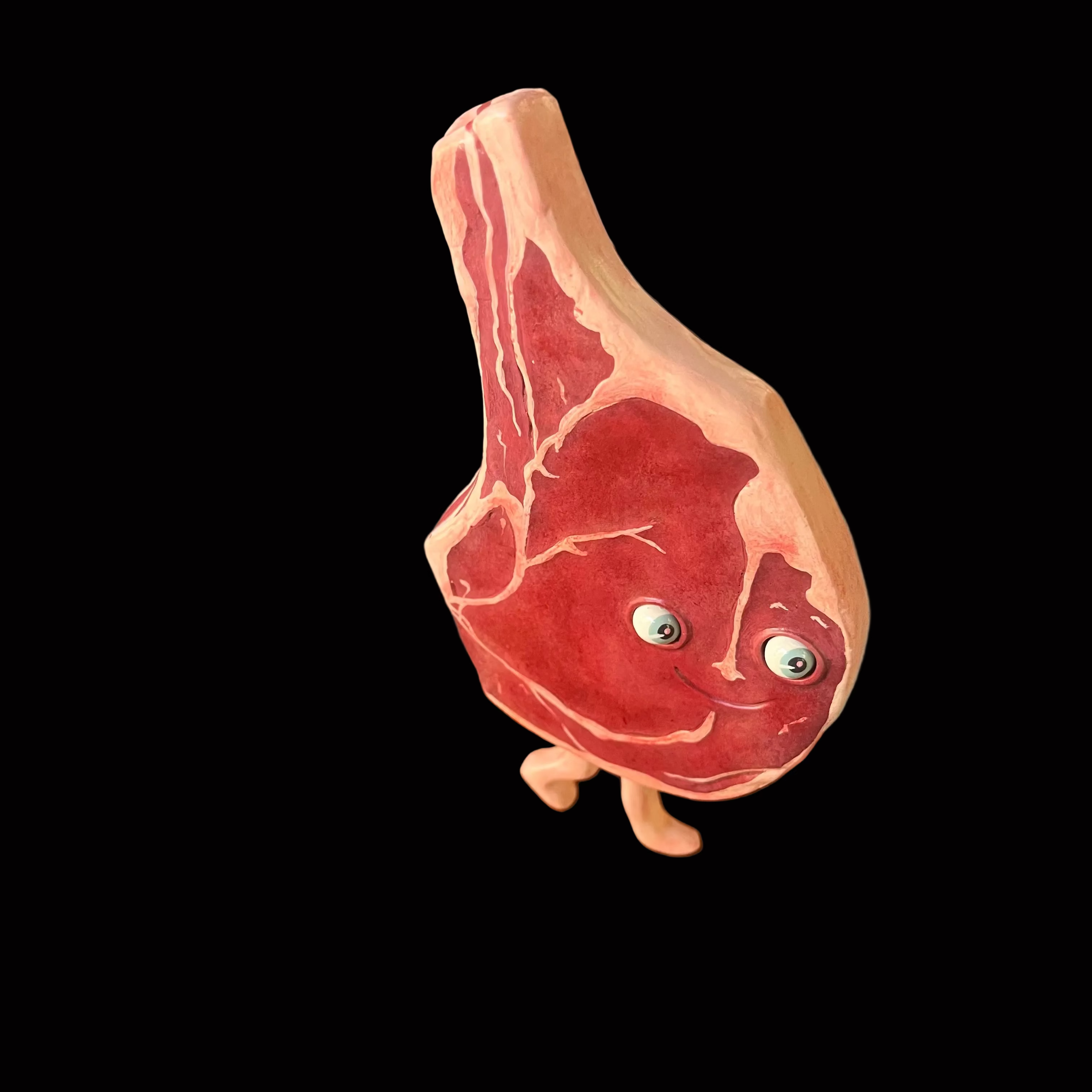 Three dimensional steak sculpture with eyes and feet 