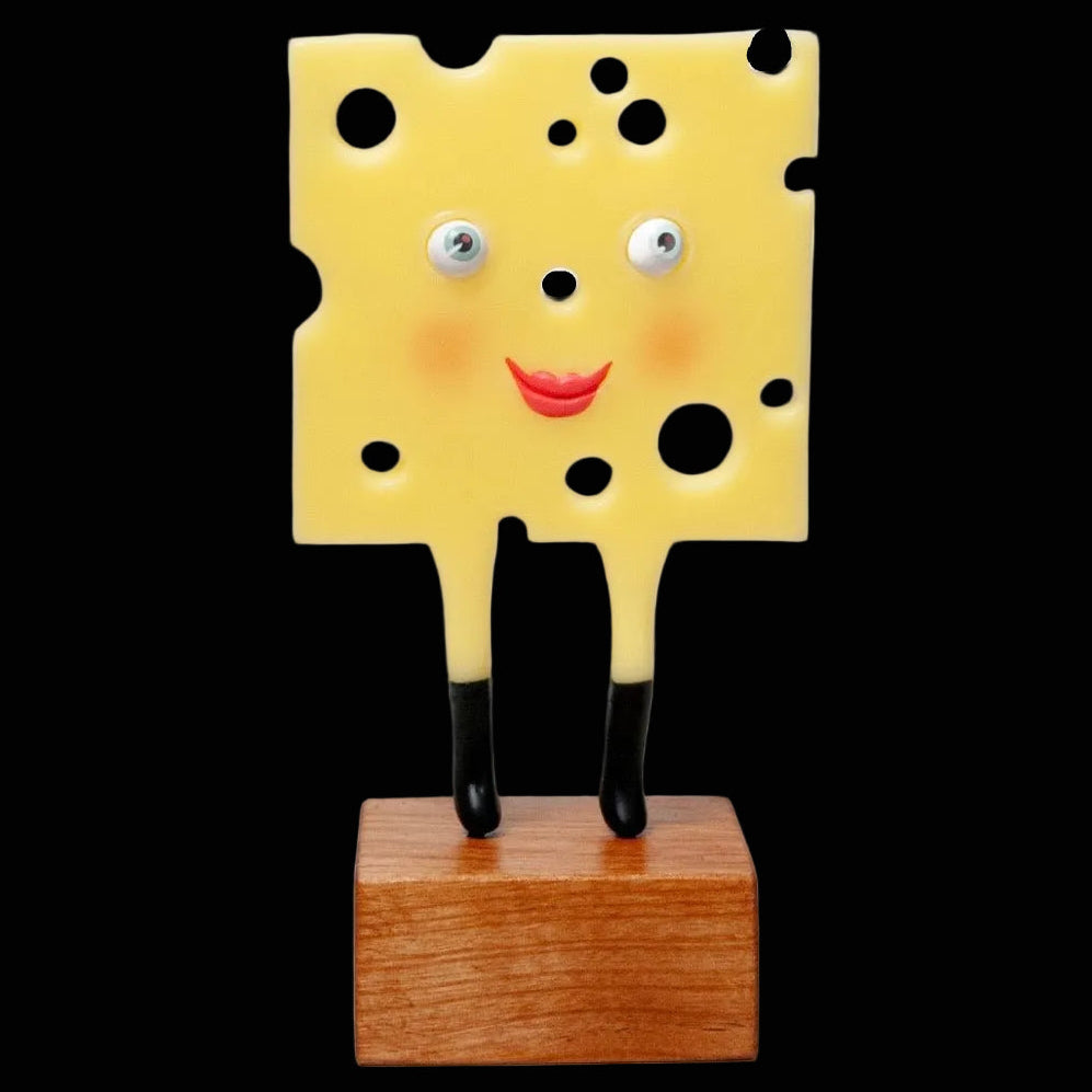 Sculpture of slice of yellow swiss cheese with black go-go boots on wood stand