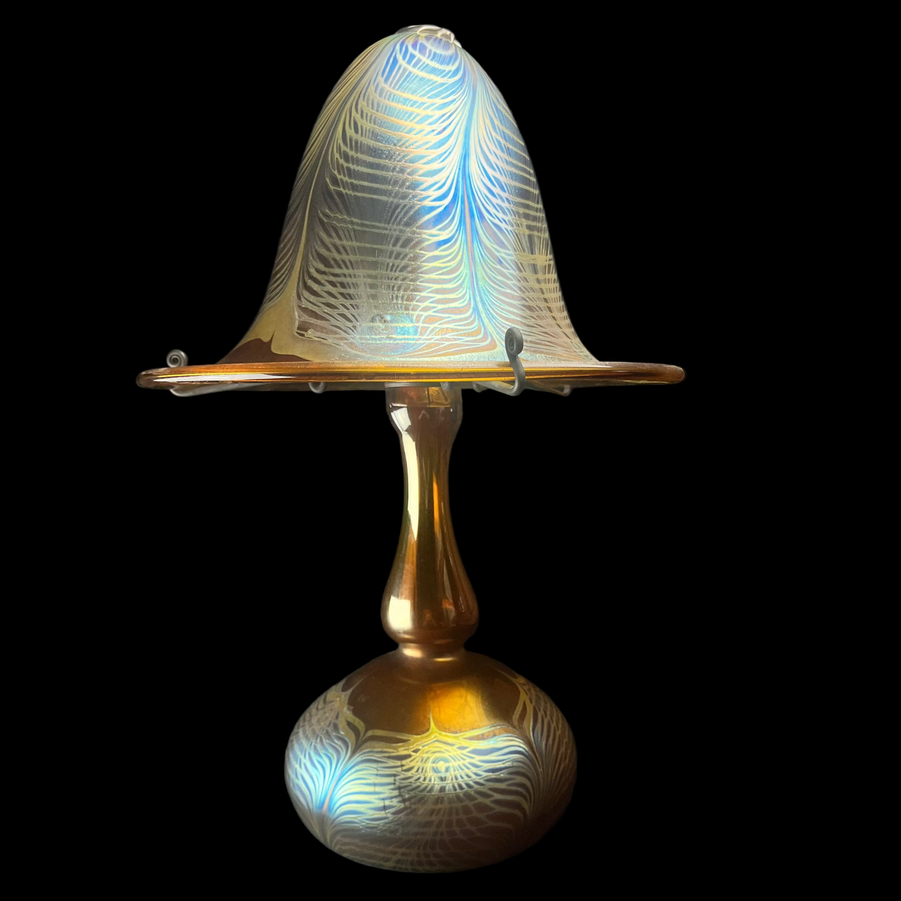 Decorative lamp with intricate design on a dark background