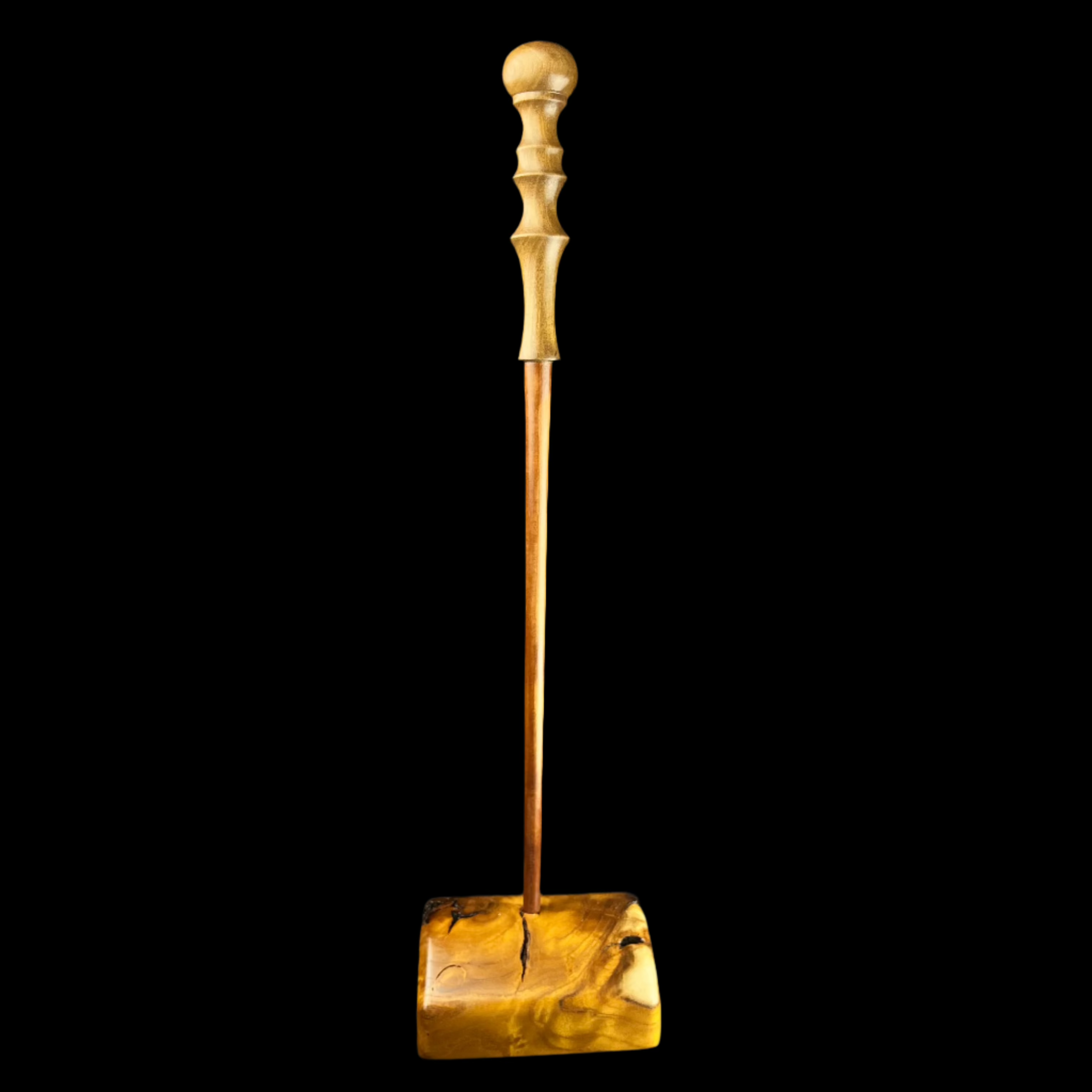 Brown wood wand standing in square base