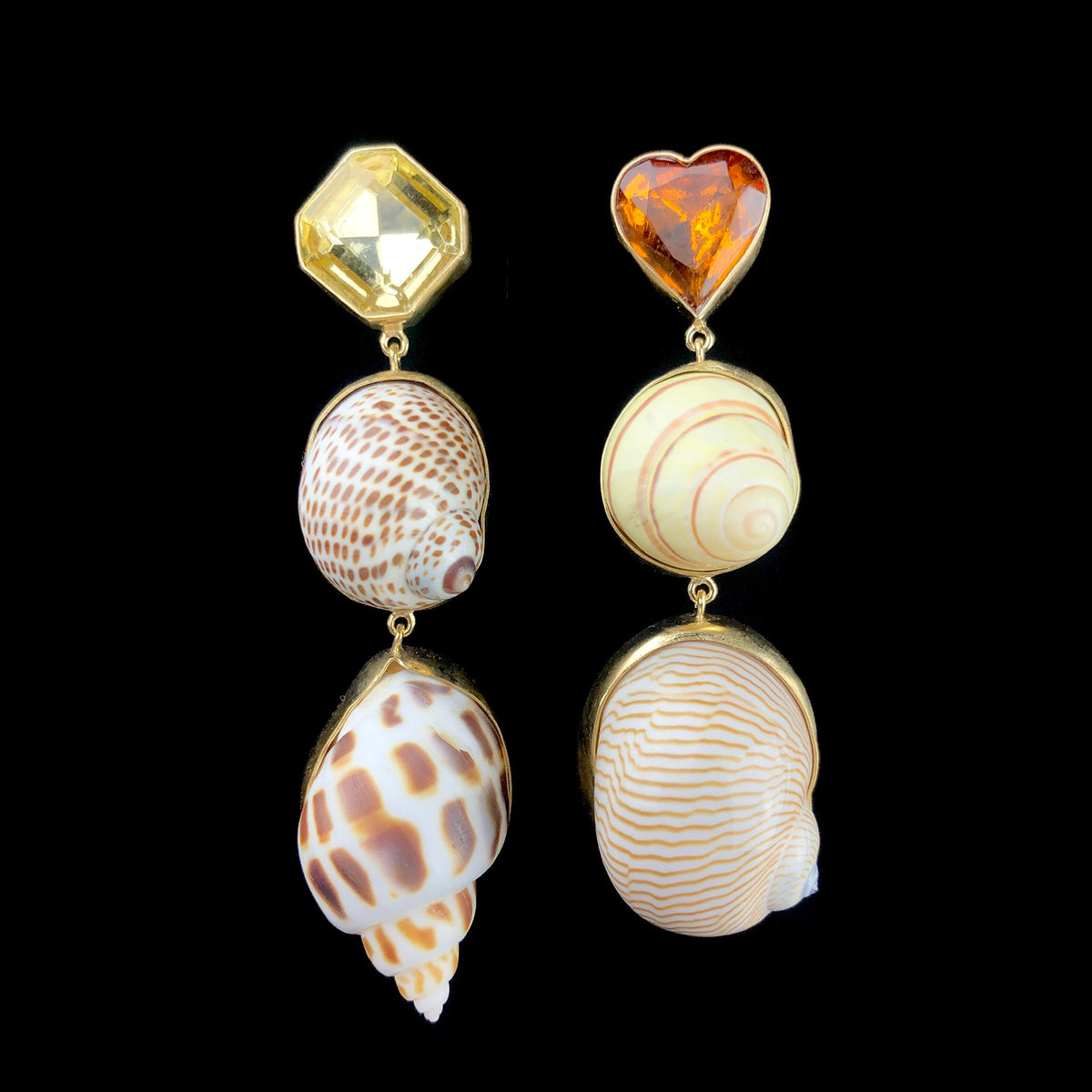 A pair of silver earrings with gold plating, featuring natural sea shells and vintage rhinestones in yellow and brown colors.