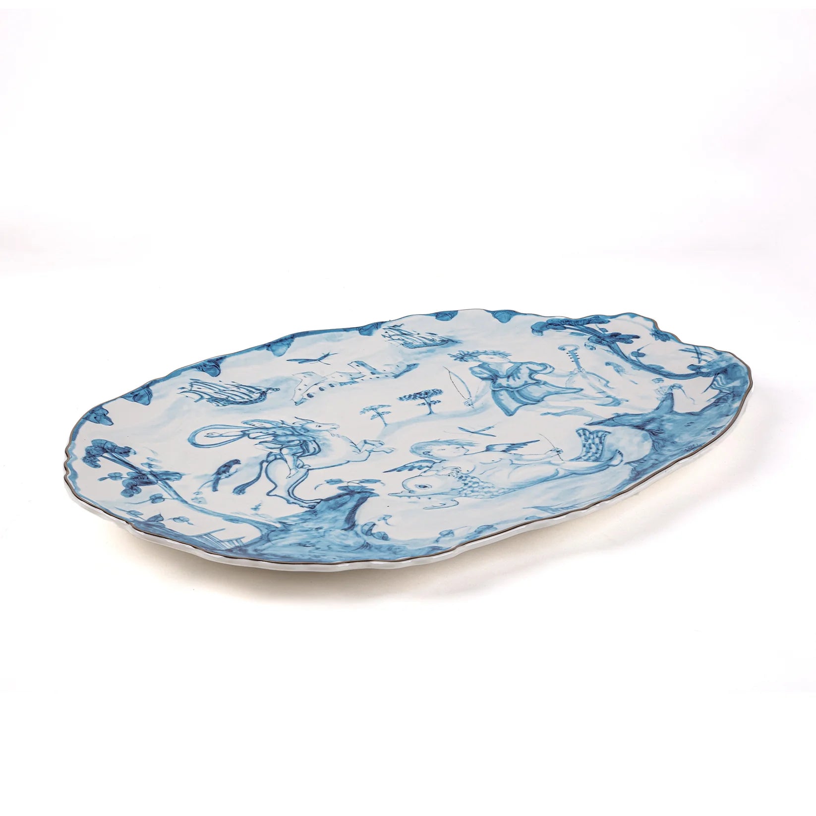 Decorative plate with blue and white design on a white background