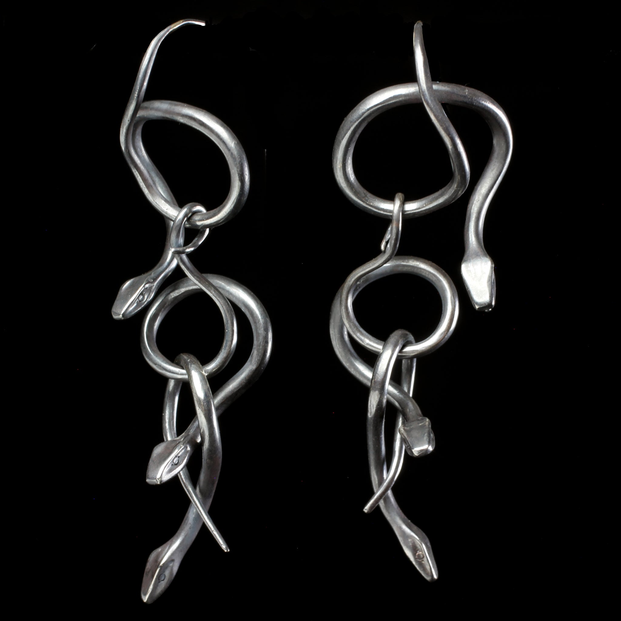 Sterling silver serpent earrings hand made by fine jewelry designer Annette Ferdinandsen