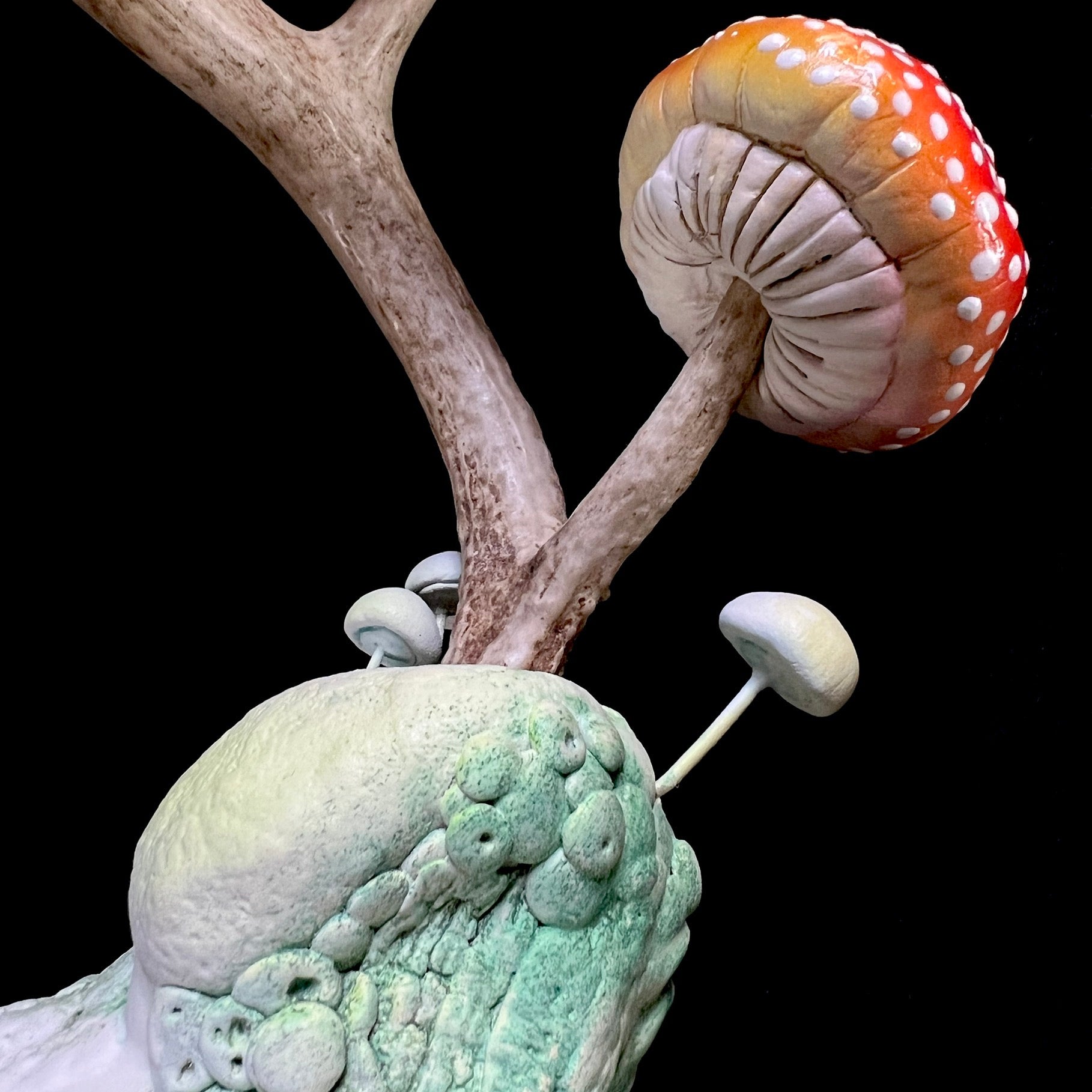 Detail of real antler and sculpted mushroom on Hear of the Forest