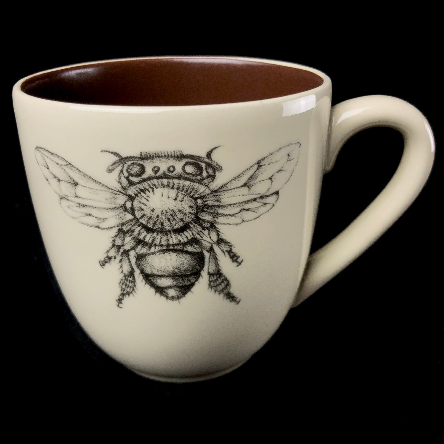 Front view of Bee Mug with brown interior