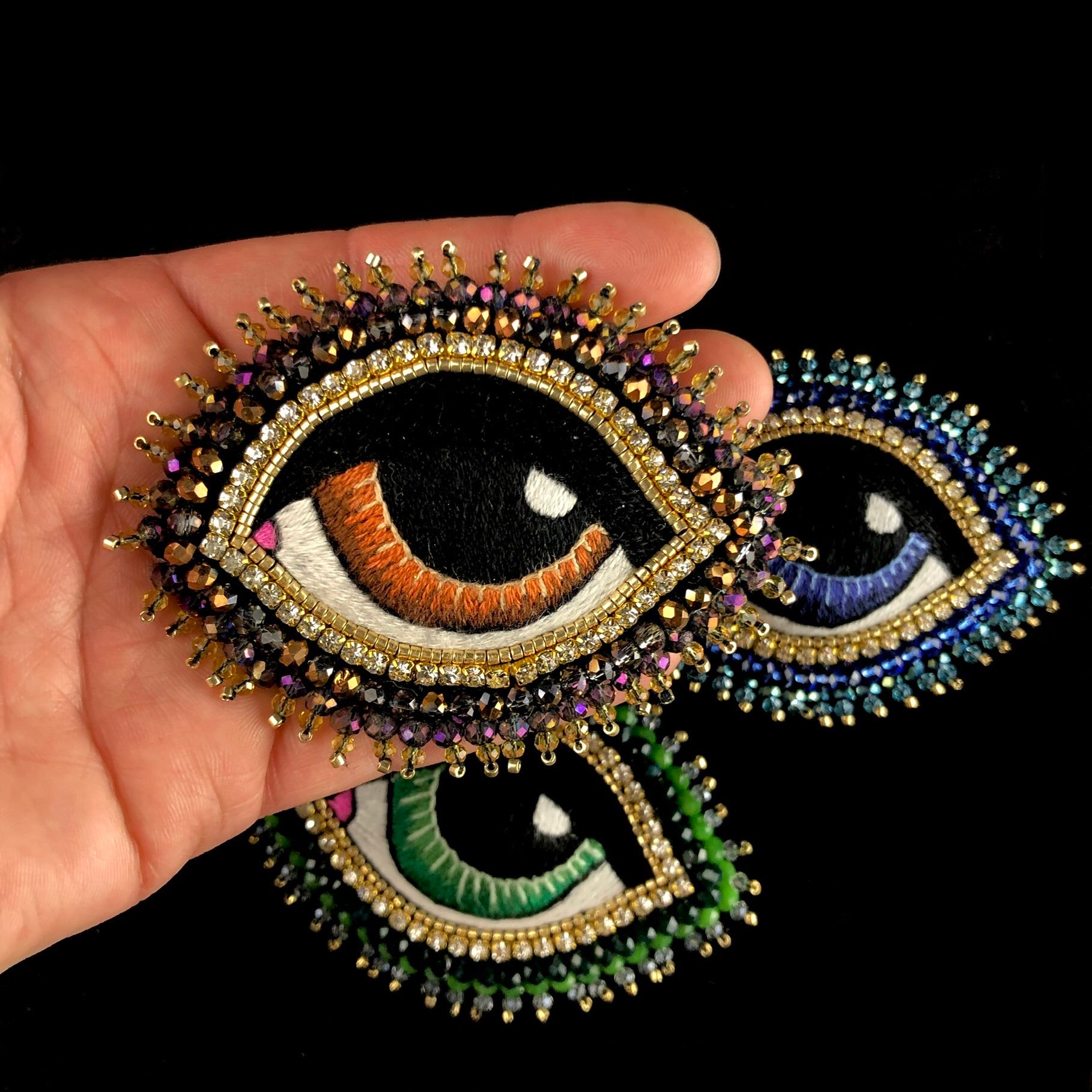 Large Brown Eye Brooch shown in hand for size referance