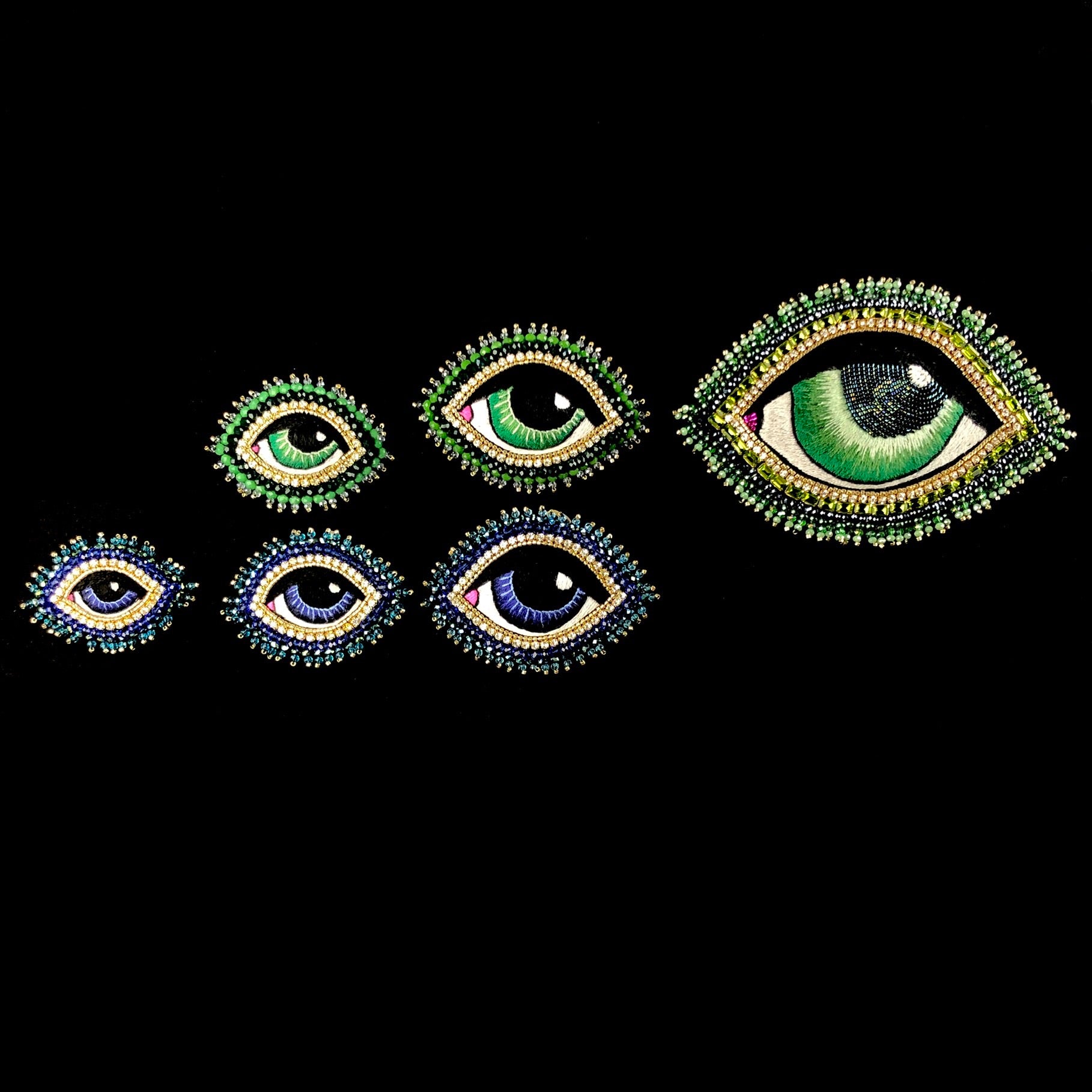 Extra Small through Extra Large Eye Brooches shown in order for size comparison