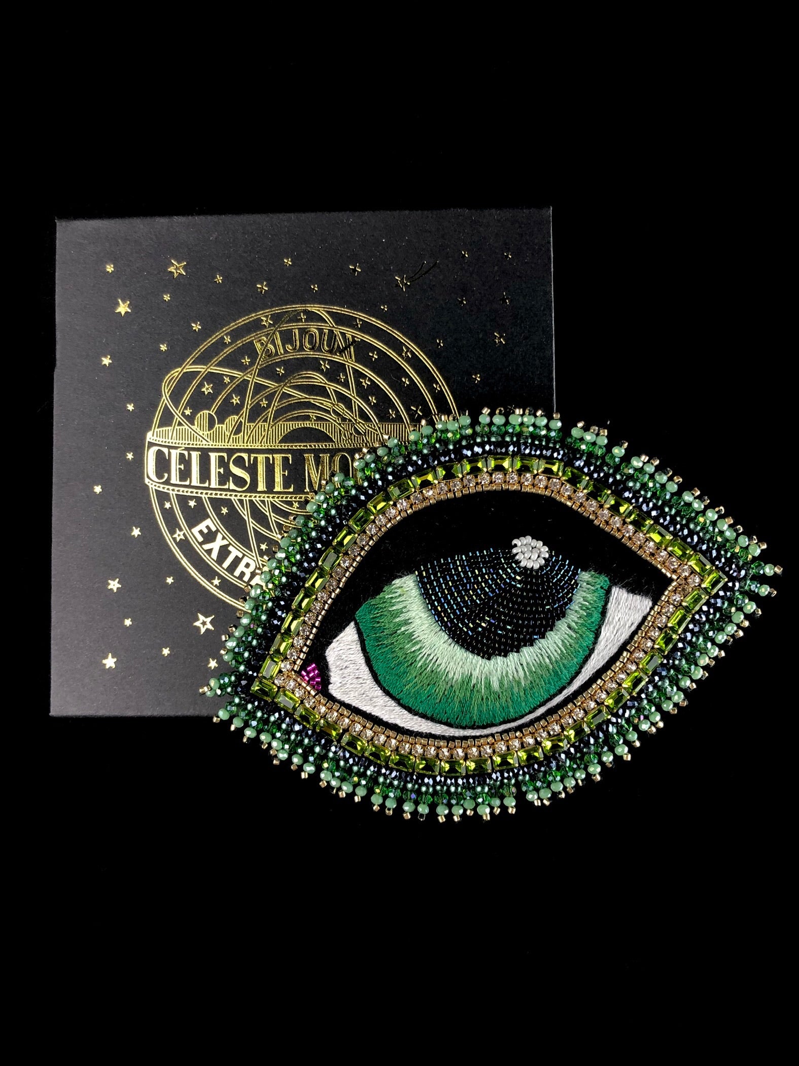 Eye Brooch shown with designer packaging